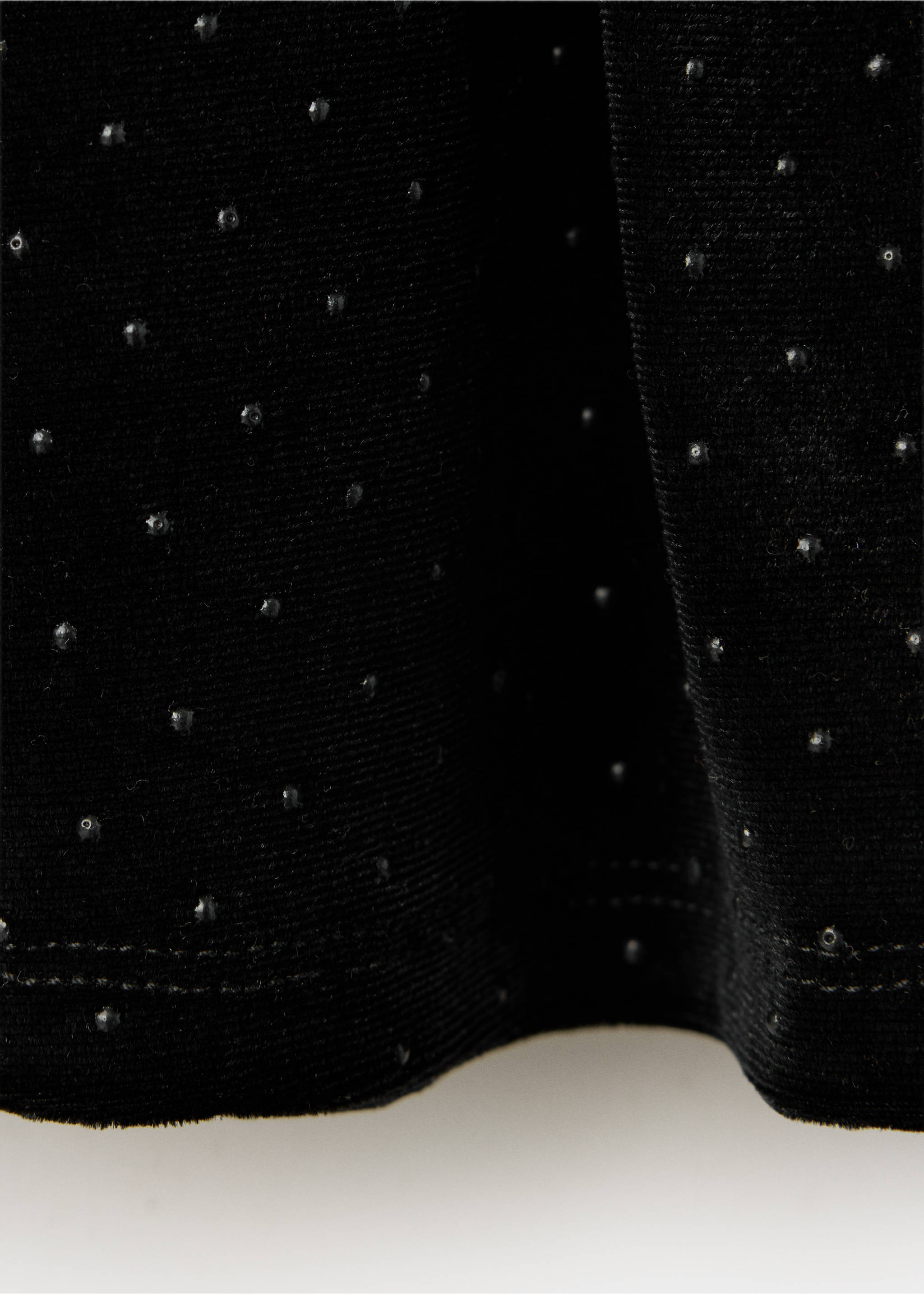 Black skirt detail showing shimmering embellished texture., Black. Ref: 37089211-00.
