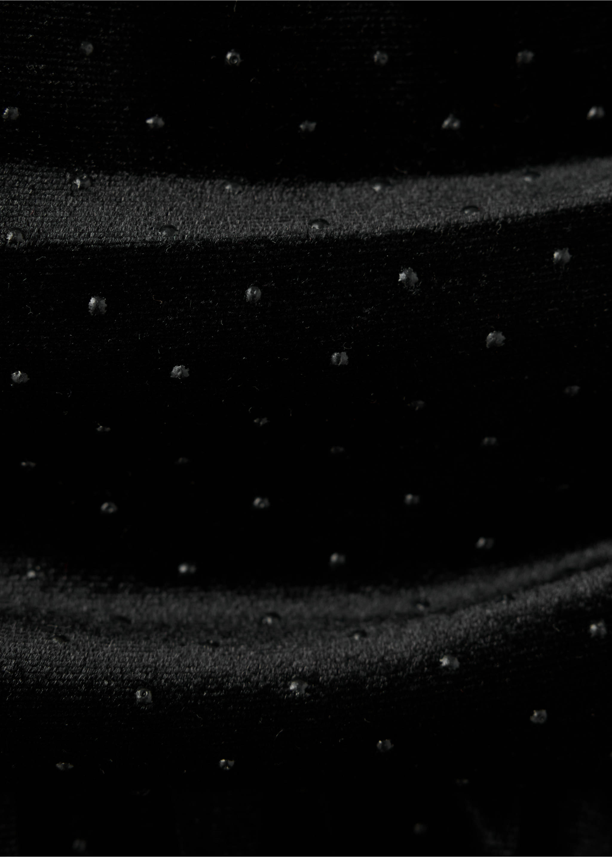 Close-up of black skirt fabric with small metallic studs., Black. Ref: 37089211-00.