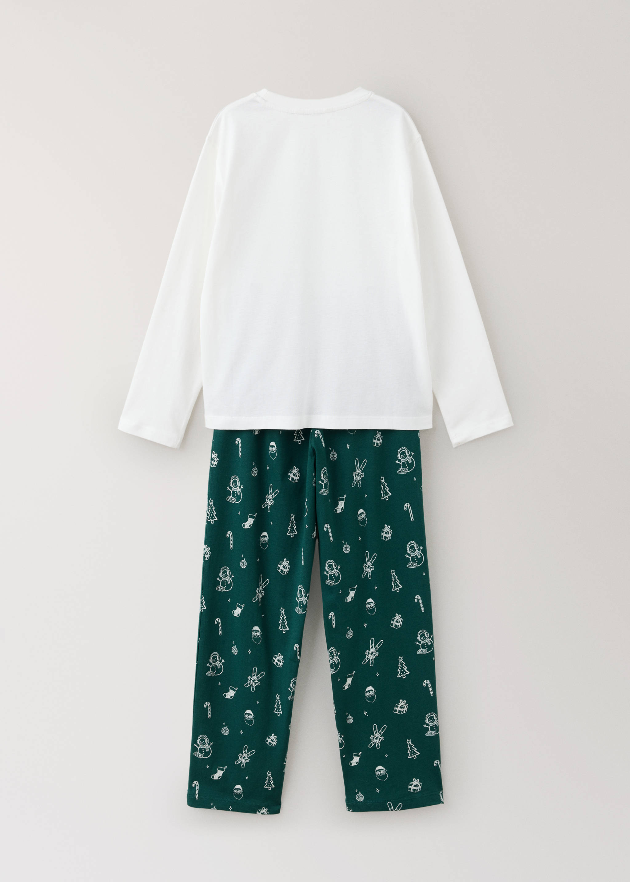 Back view of a white long-sleeved top and dark green patterned pyjama trousers.