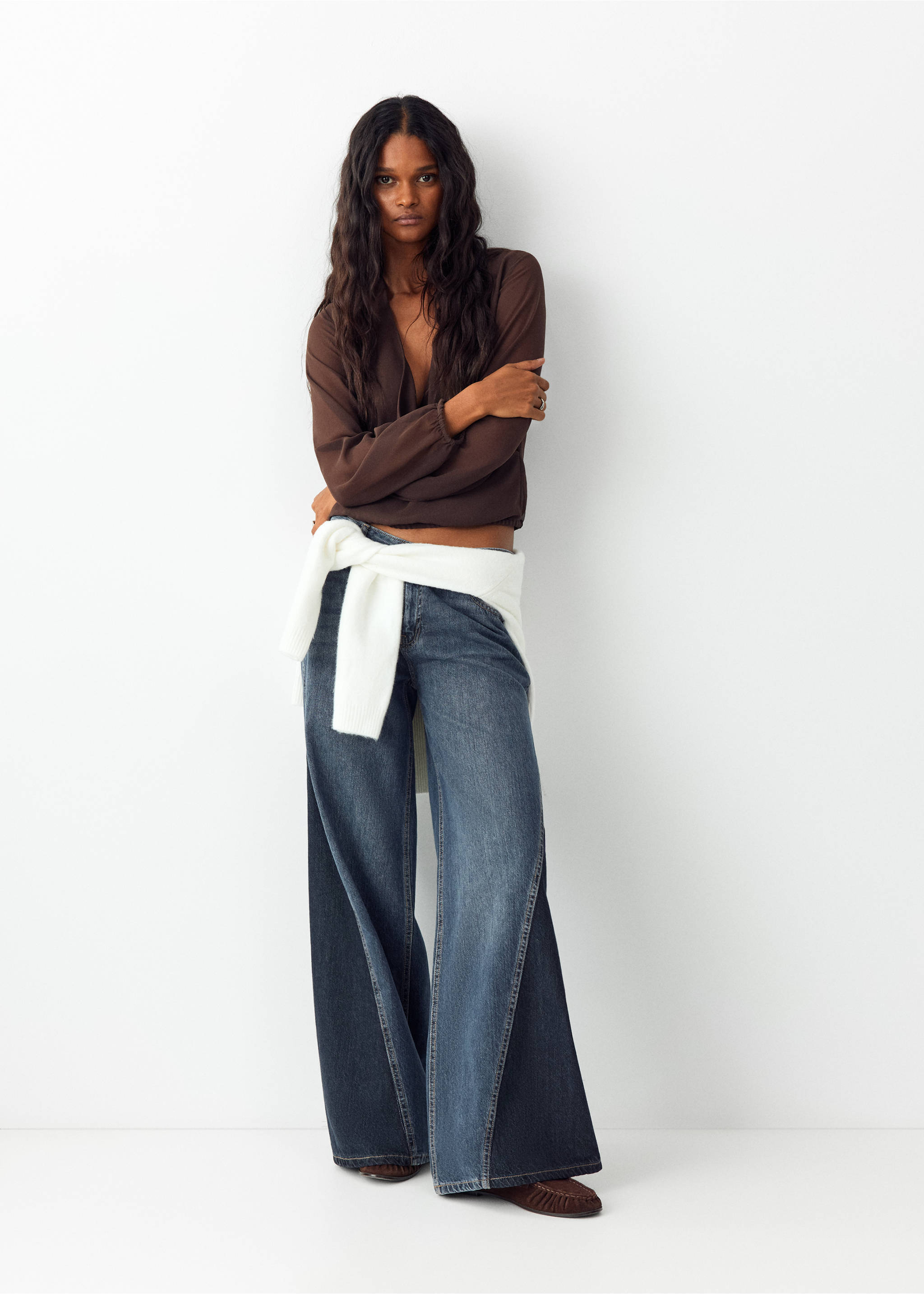 Blue wide-leg denim trousers with contrast side panels, worn with a brown top and a white jumper tied around the waist., Dark Blue. Ref: 37089214-00.