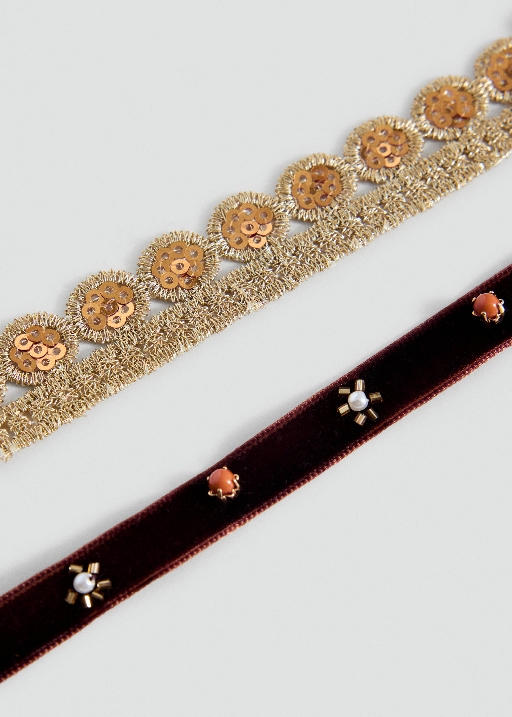 Gold metallic sequined lace collar and a burgundy velvet collar with bead and stone embellishments.
