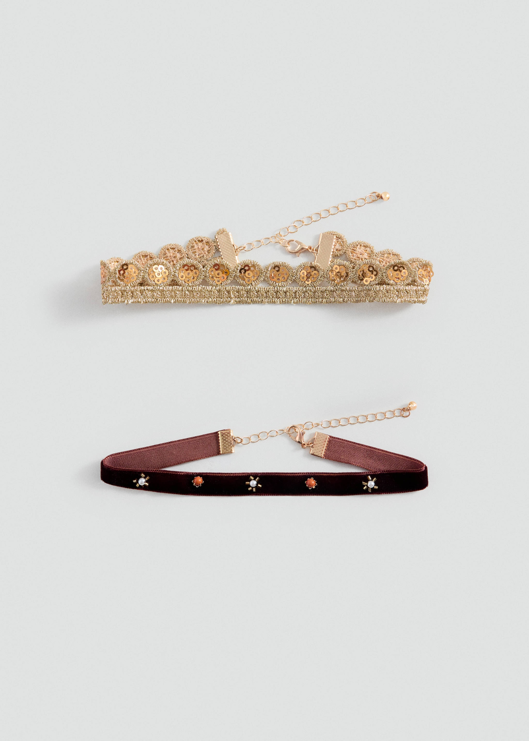 Set of two collars: one gold sequinned lace collar and one burgundy velvet collar with beaded floral details.
