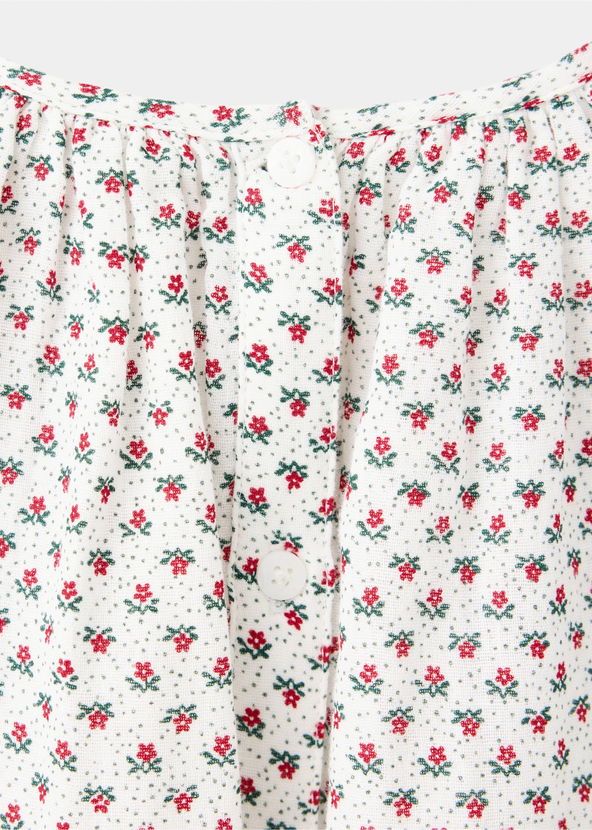 Close-up of a white floral print blouse with gathered neckline and white buttons., Off White. Ref: 37089217-00.