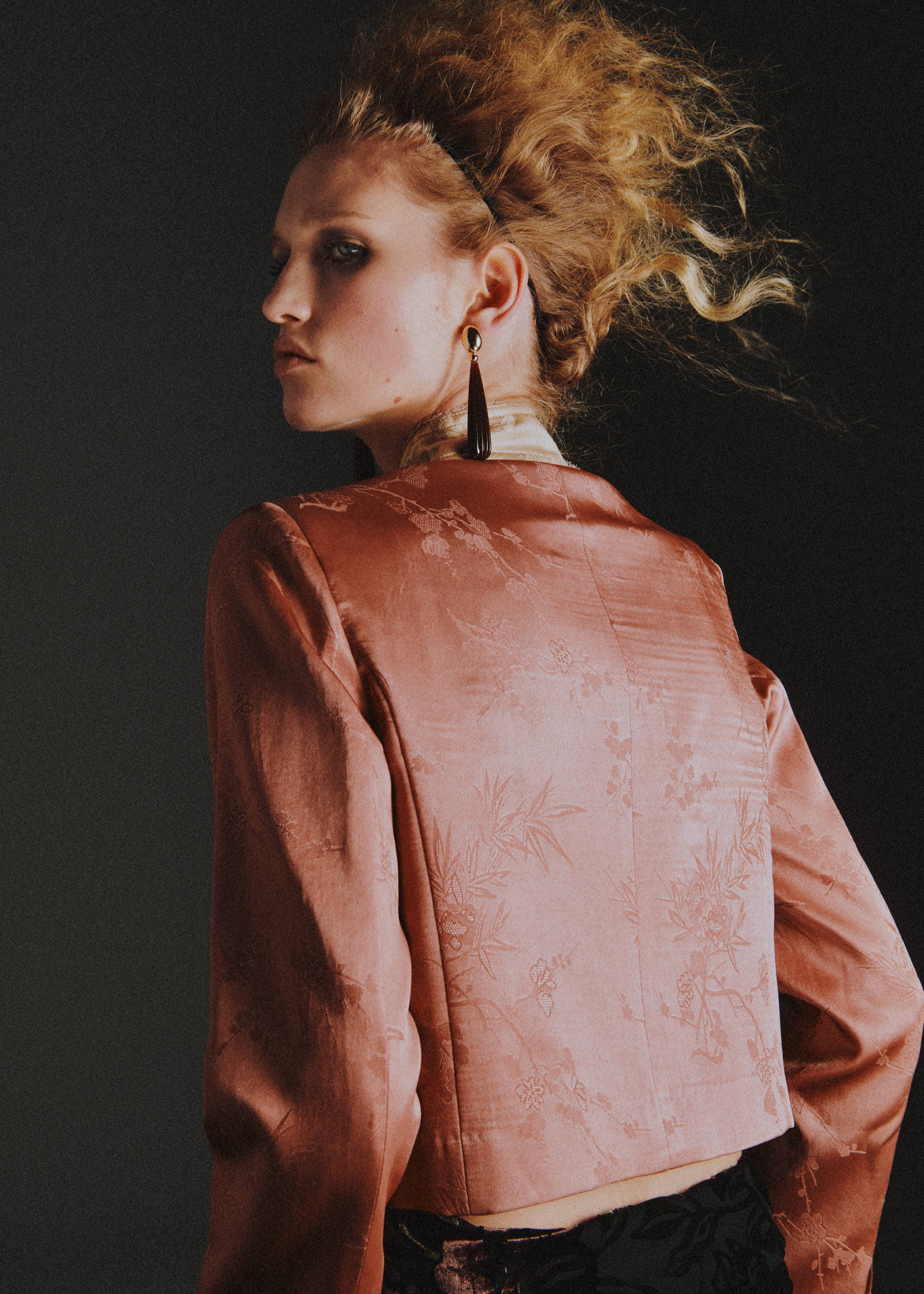 Pink cropped floral jacquard blazer, back view.