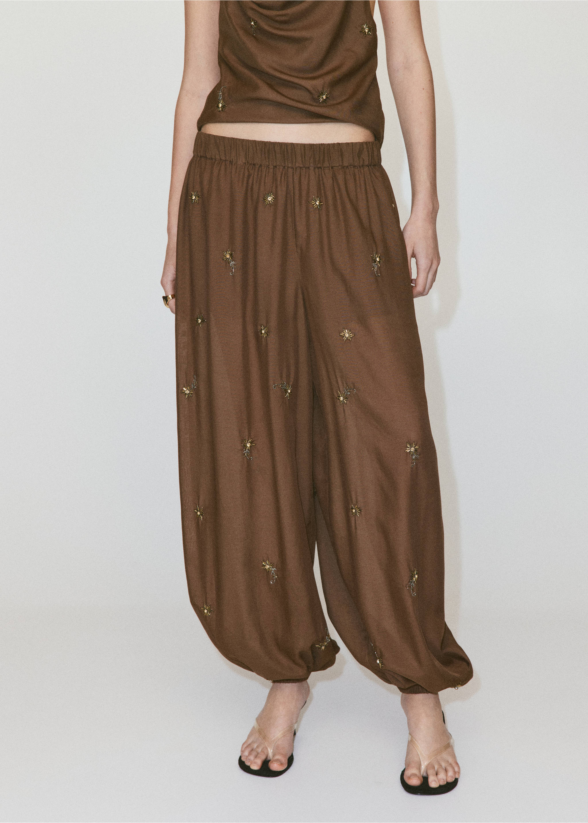 Balloon trousers with embroidered appliqués - Details of the article 3, Brown. Ref: 37091369-00.