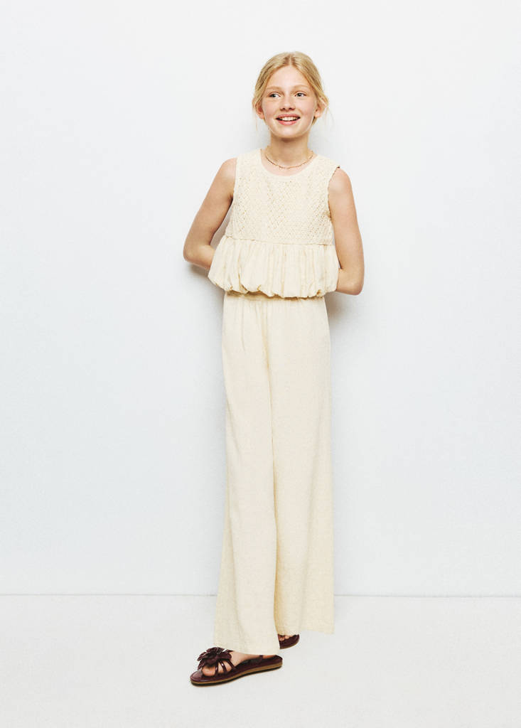 Crochet blouse with a puffed hem