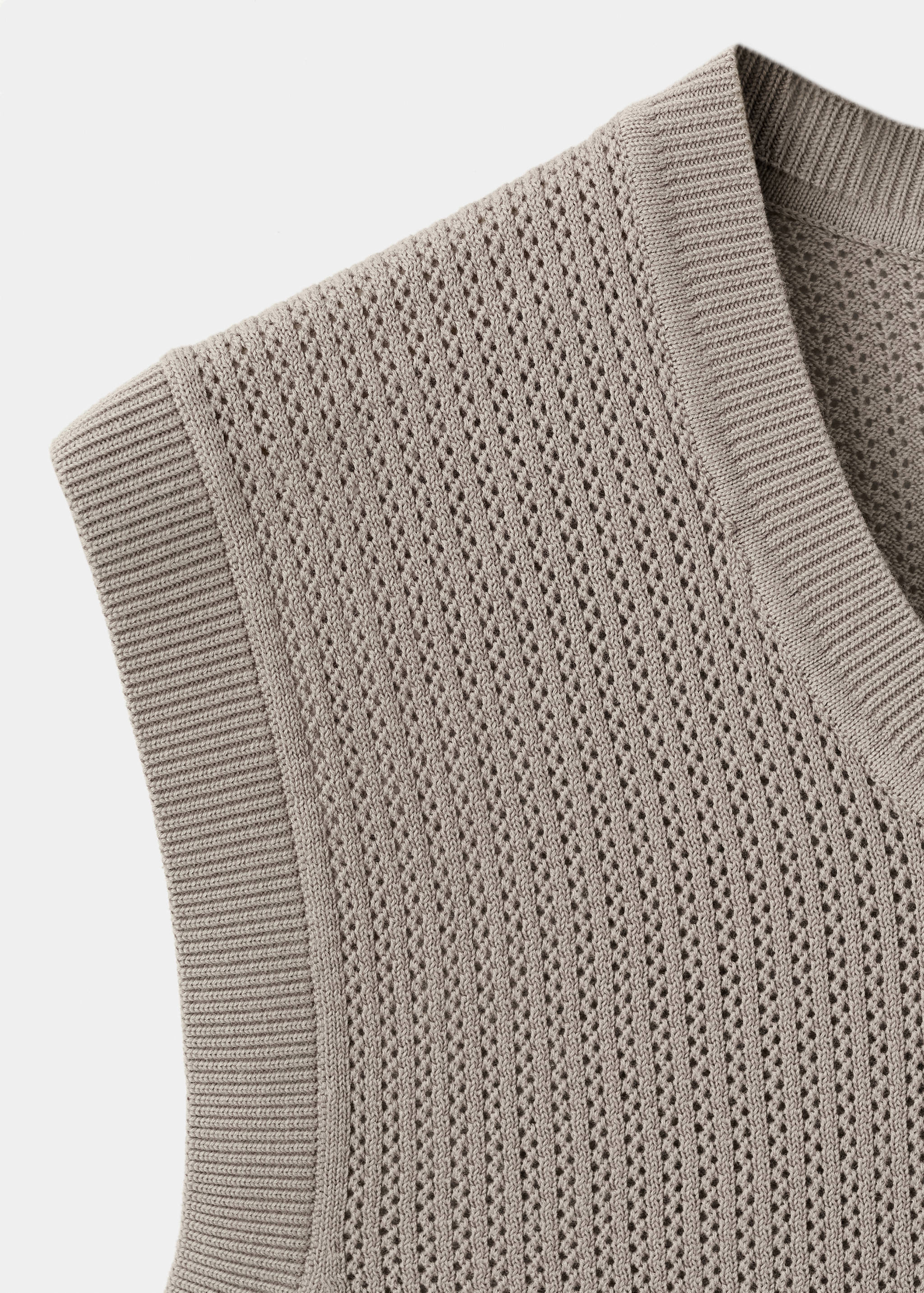 Fijngebreid gilet - Detail van het artikel 8