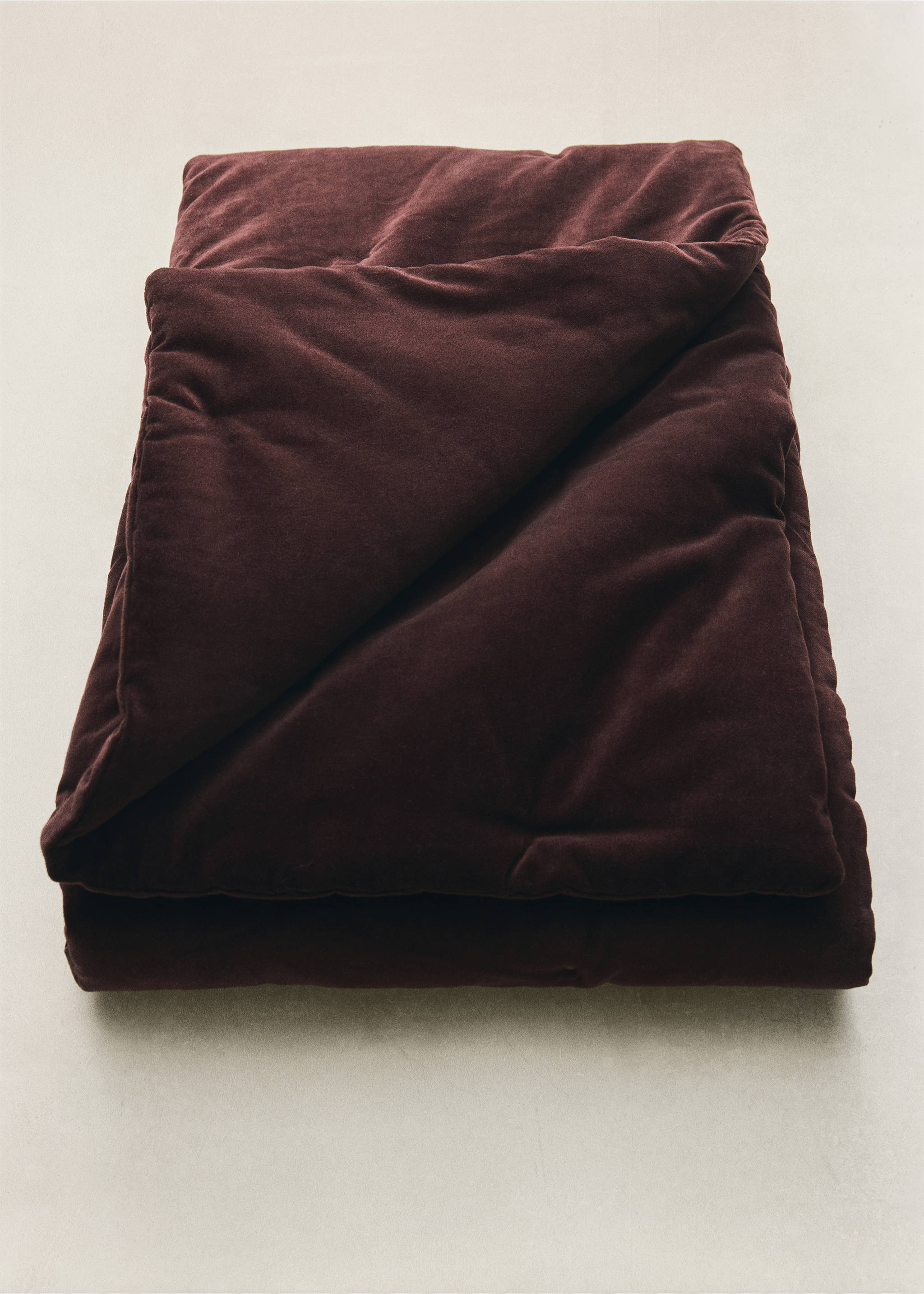 Dark burgundy quilted velvet duvet in a still-life setting., Dark Red. Ref: 37092907-00.