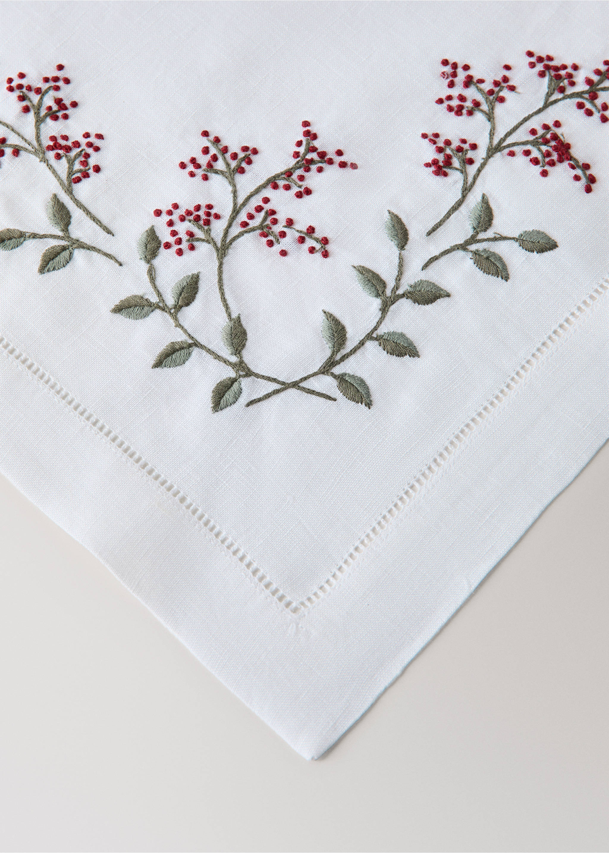 White placemat with embroidered red berry branches and hemstitch., White. Ref: 37092909-00.