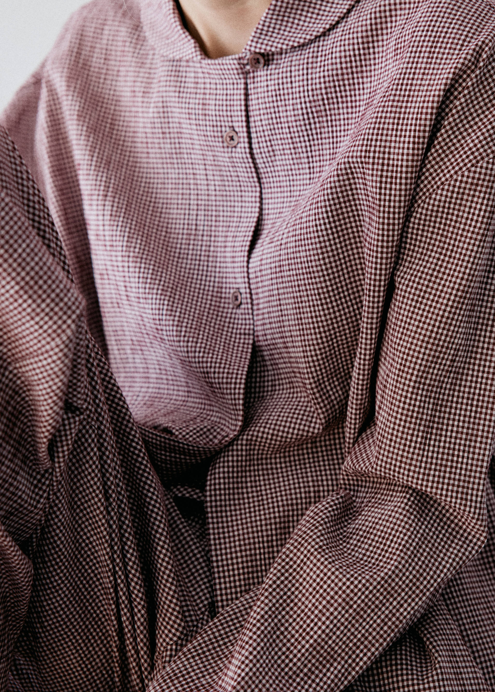 Burgundy gingham pyjama set with a round collar and button placket