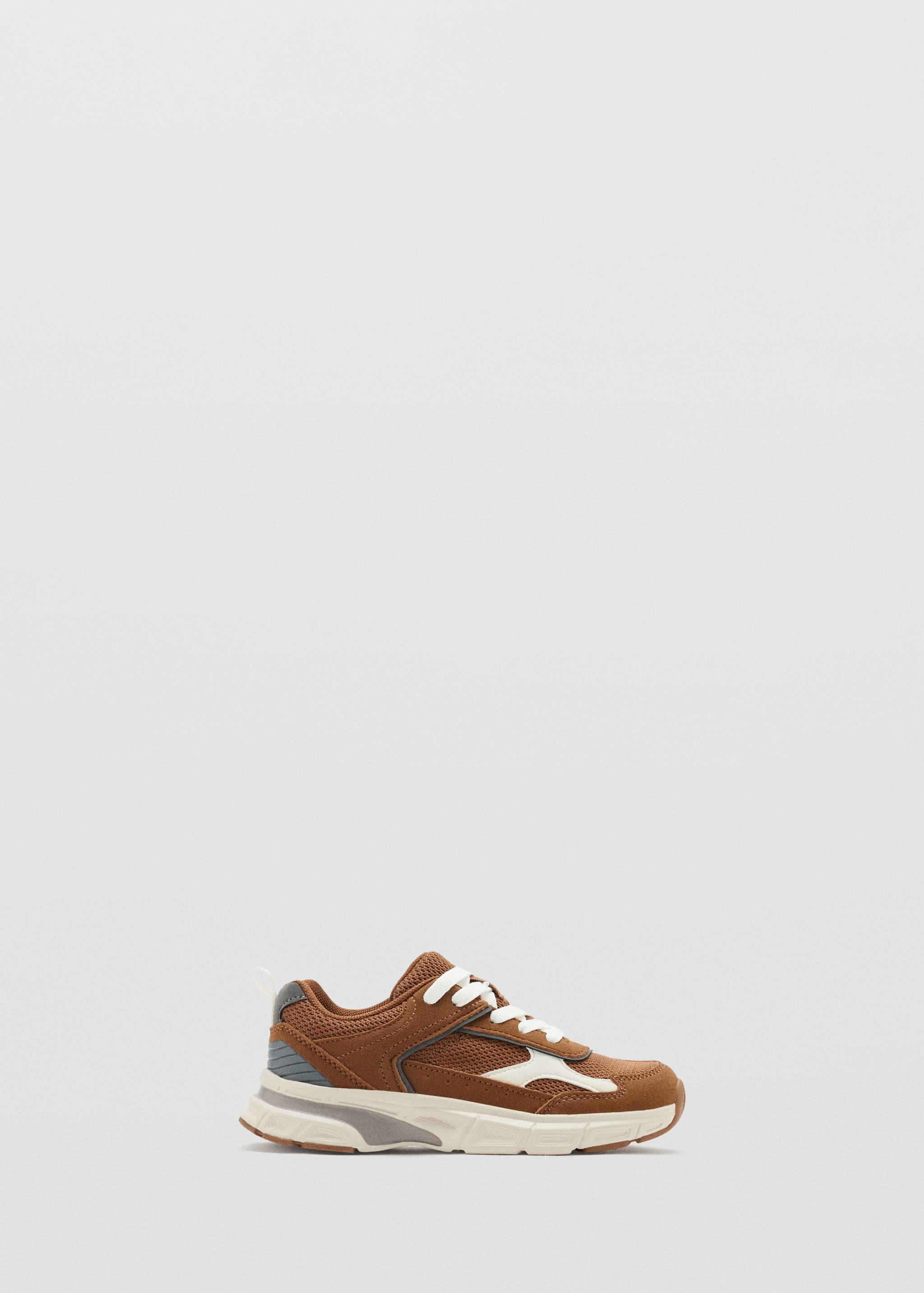 Brown children's trainers with white laces and chunky soles.