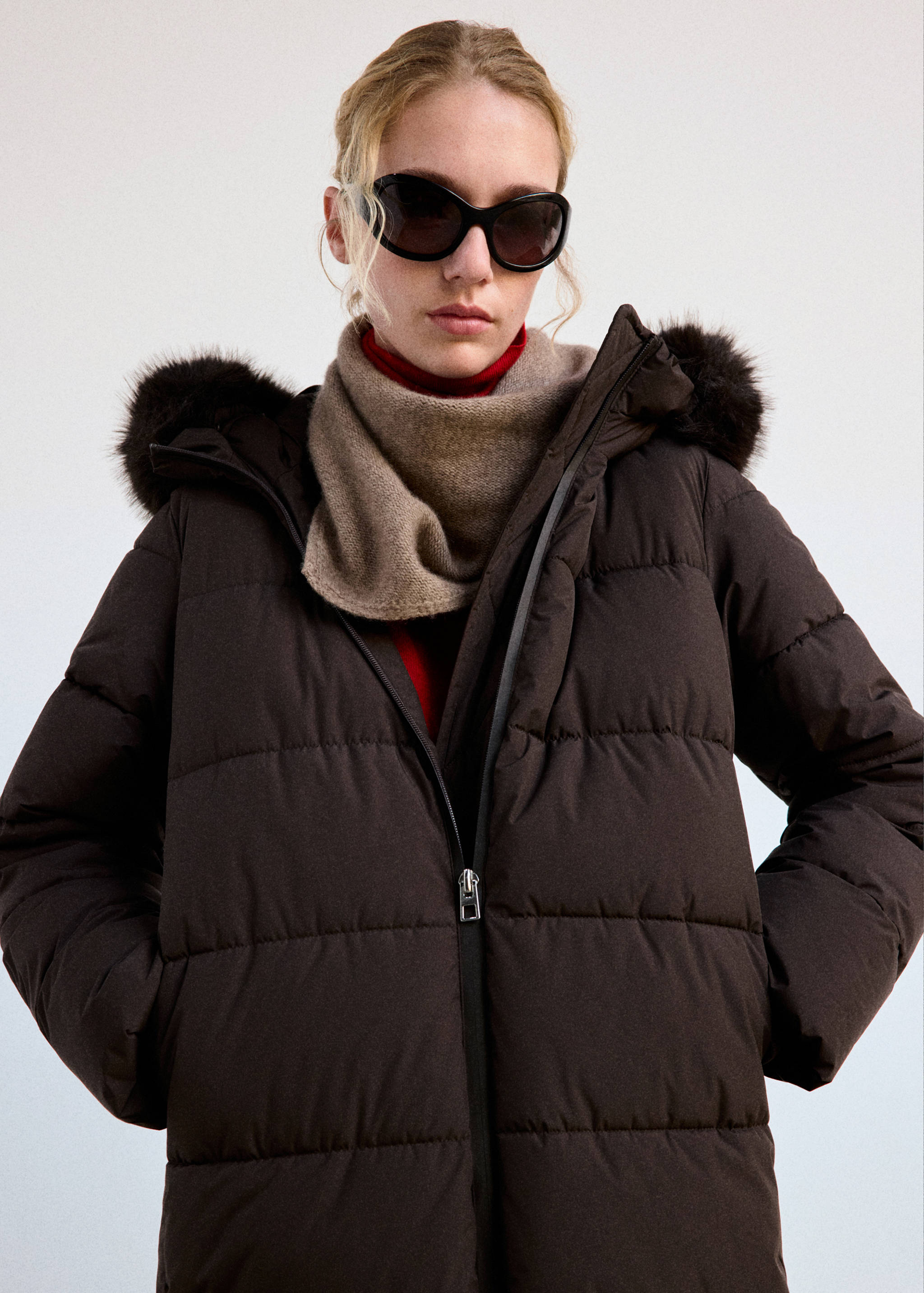 Dark brown quilted anorak with a faux-fur trimmed hood.