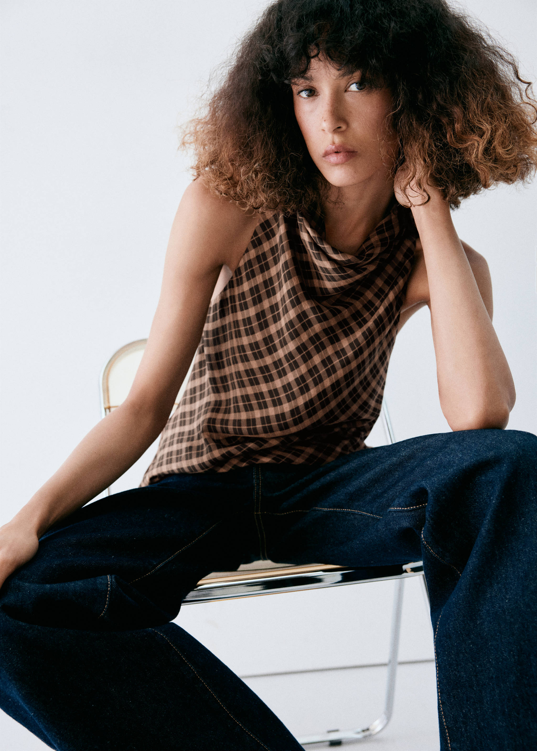 Brown and black checkered halter top with a cowl neck.
