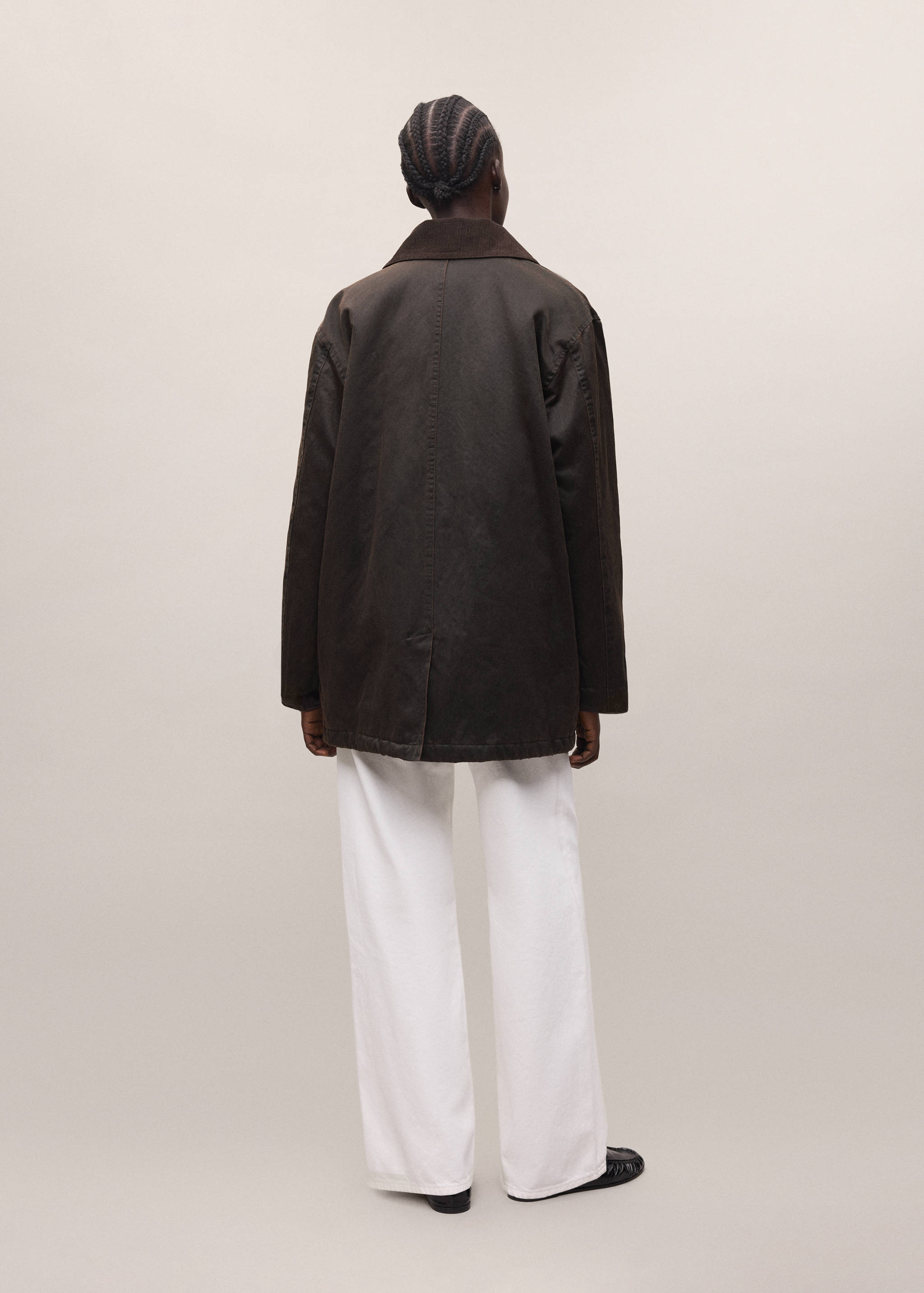 Dark brown parka with corduroy collar, shown from the back.