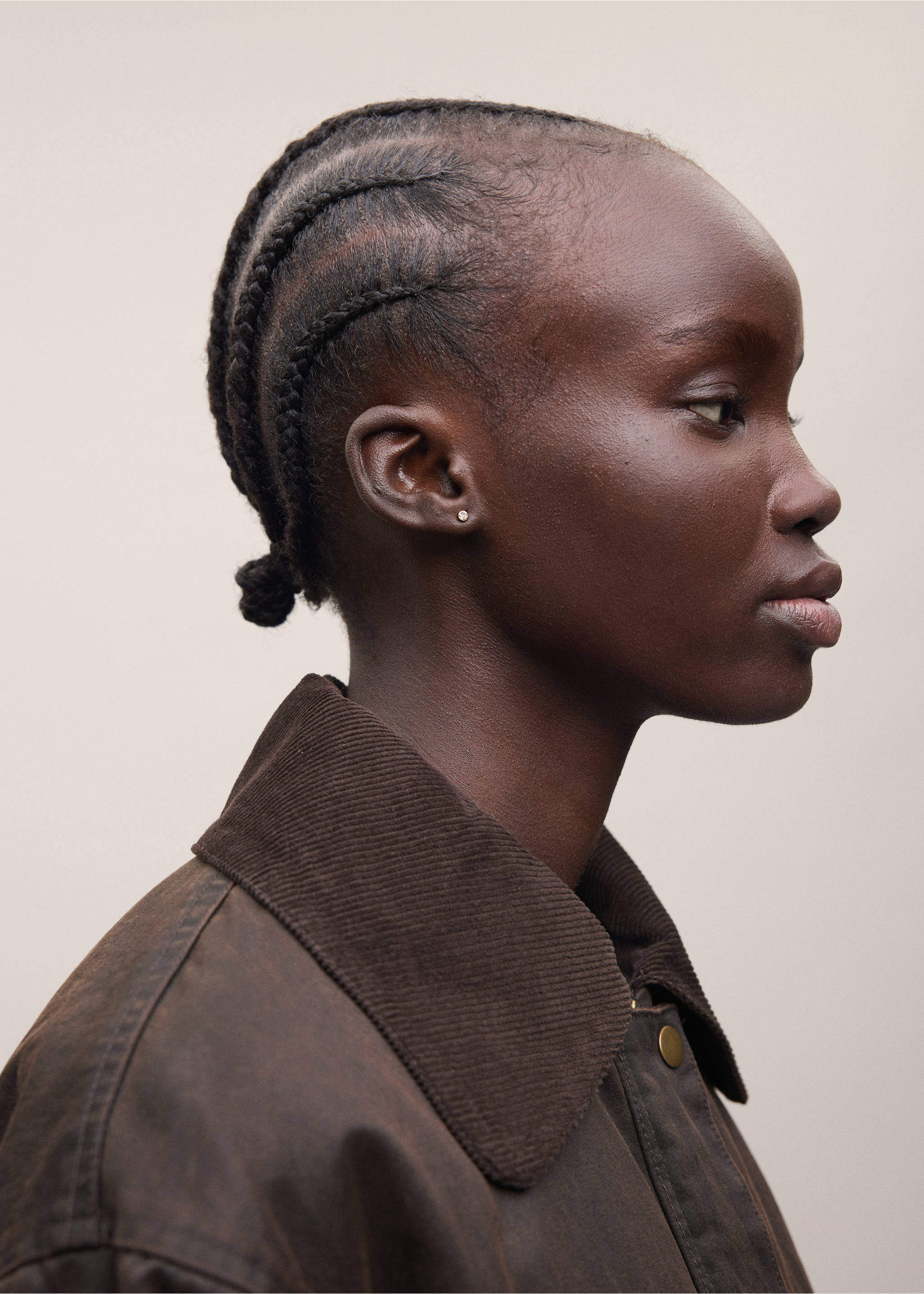 Dark brown parka with a corduroy collar and snap button closure, shown in a close-up portrait view., Chocolate. Ref: 37095150-01.