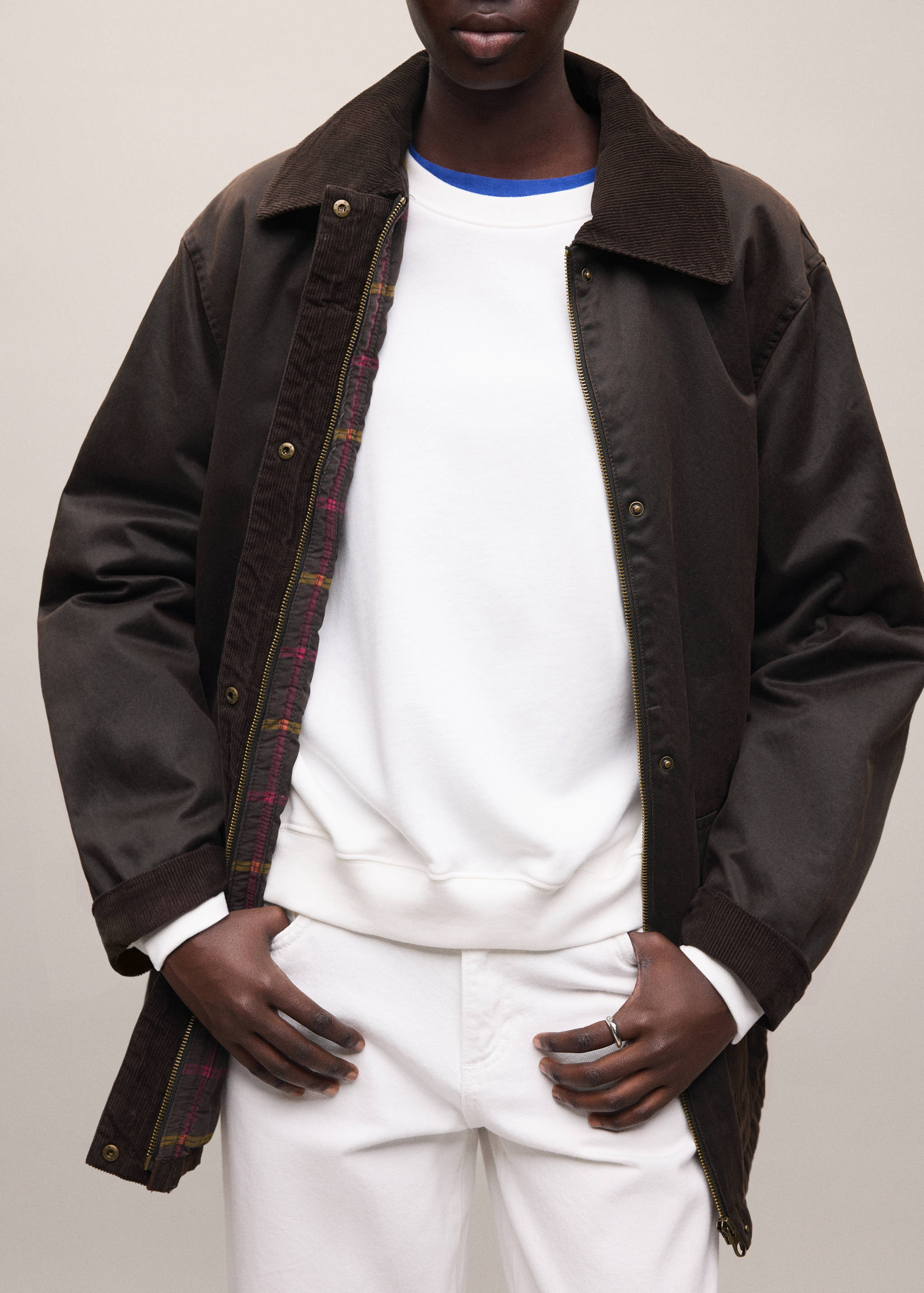 Dark brown parka with a corduroy collar and tartan lining