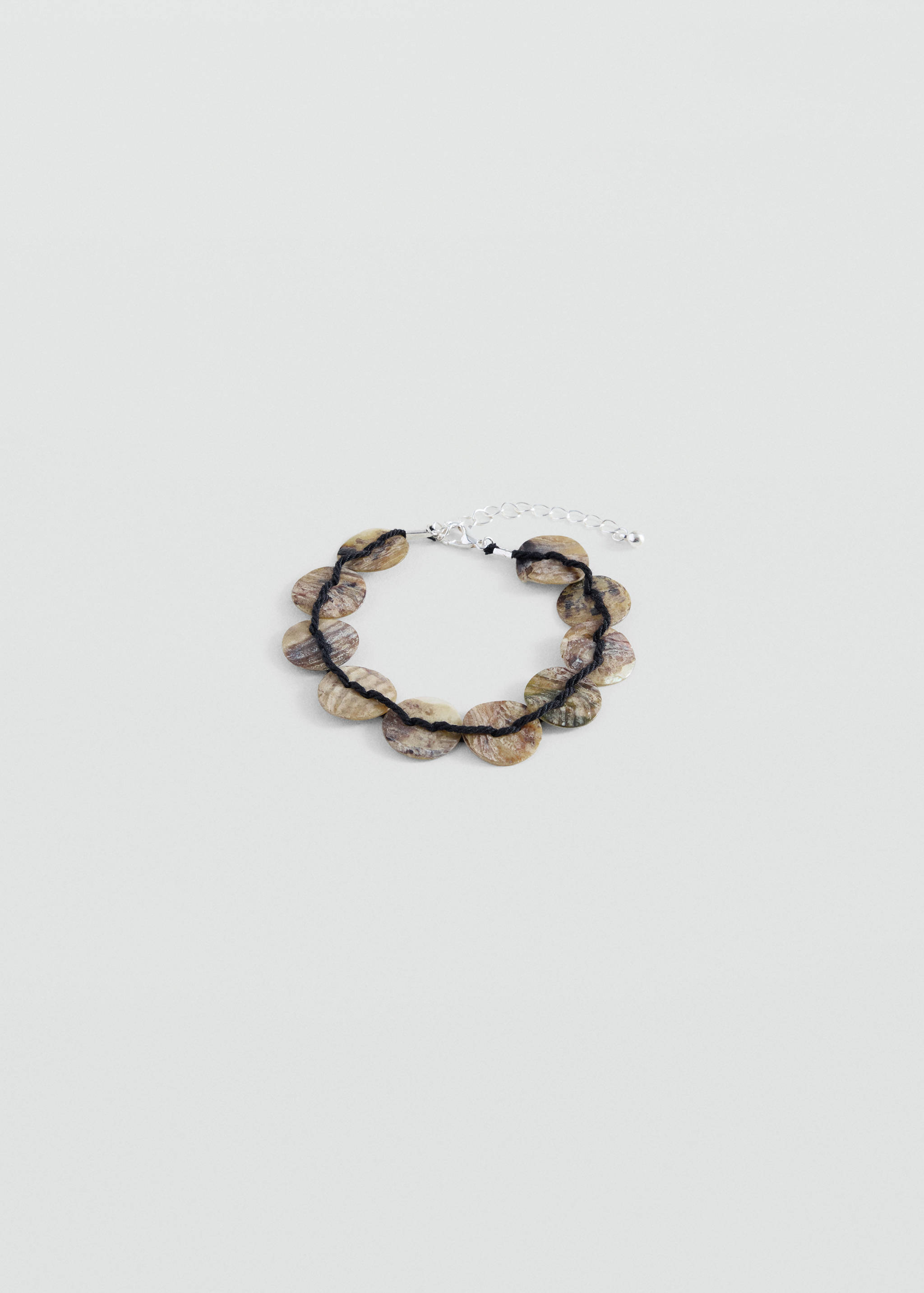 Shell bead bracelet in mottled brown and beige with a dark cord and silver-tone clasp.