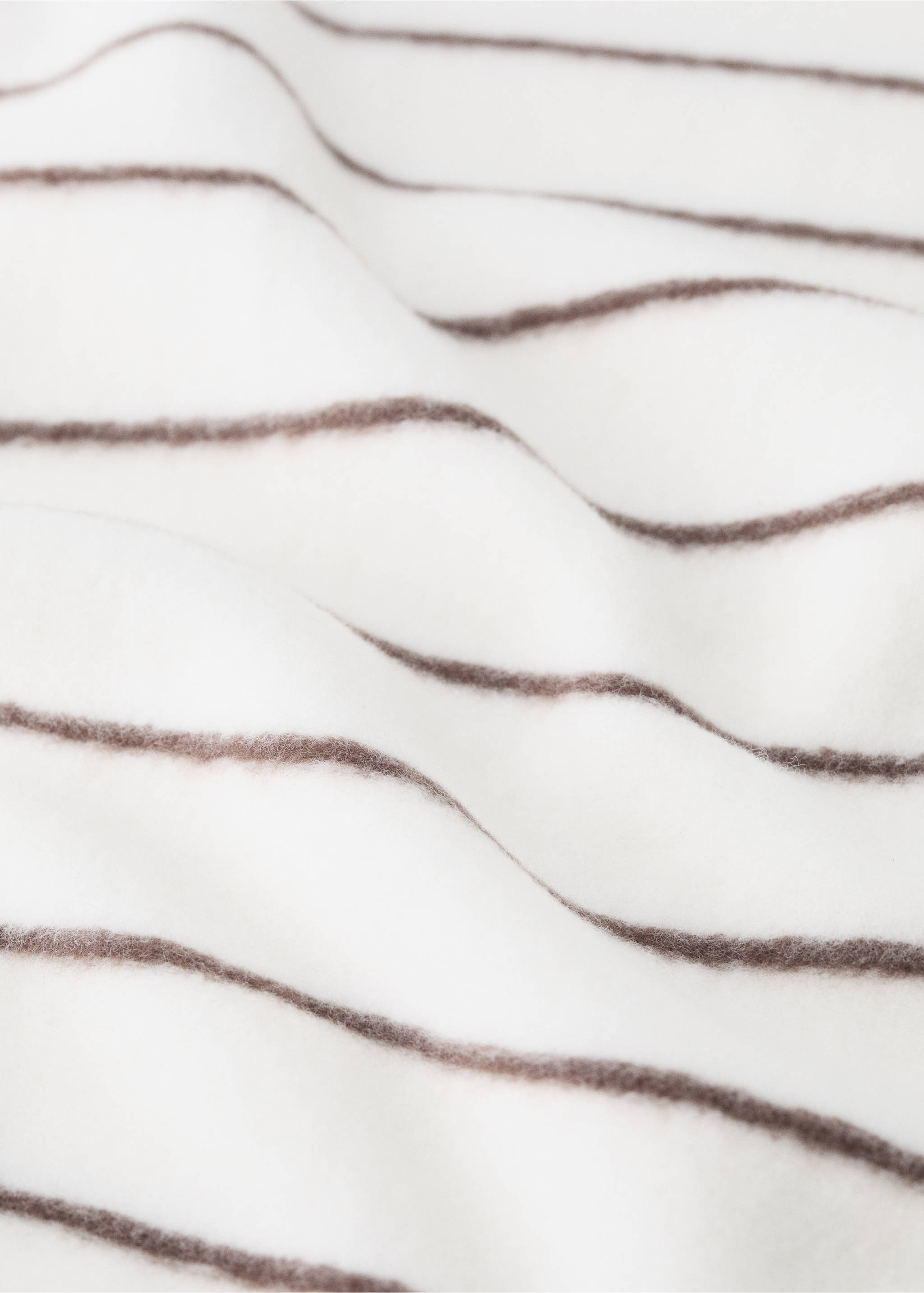 Close-up of a soft white blanket with brown horizontal stripes., Medium Brown. Ref: 37095180-00.