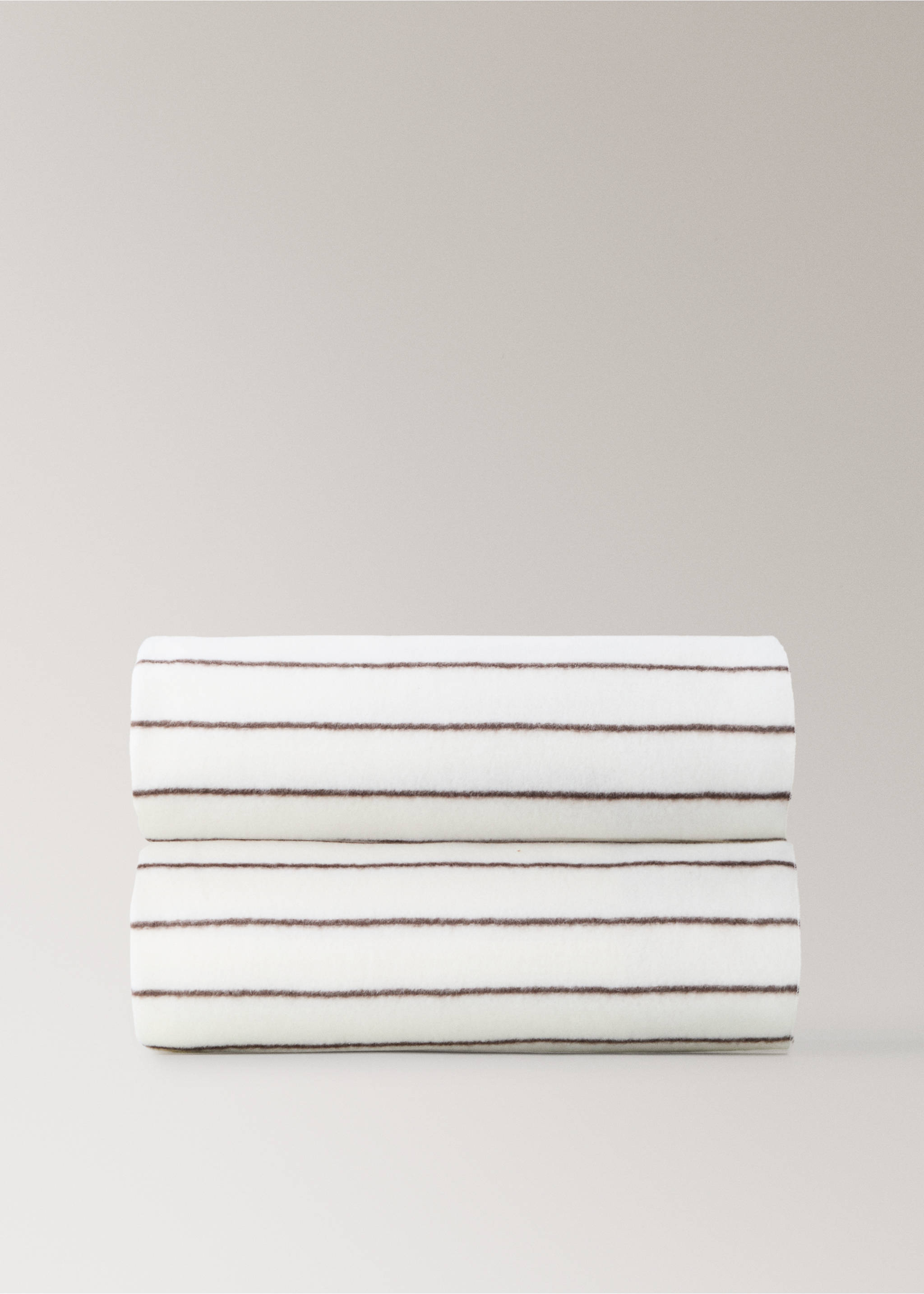 White blanket with thin brown horizontal stripes, neatly folded., Medium Brown. Ref: 37095180-00.