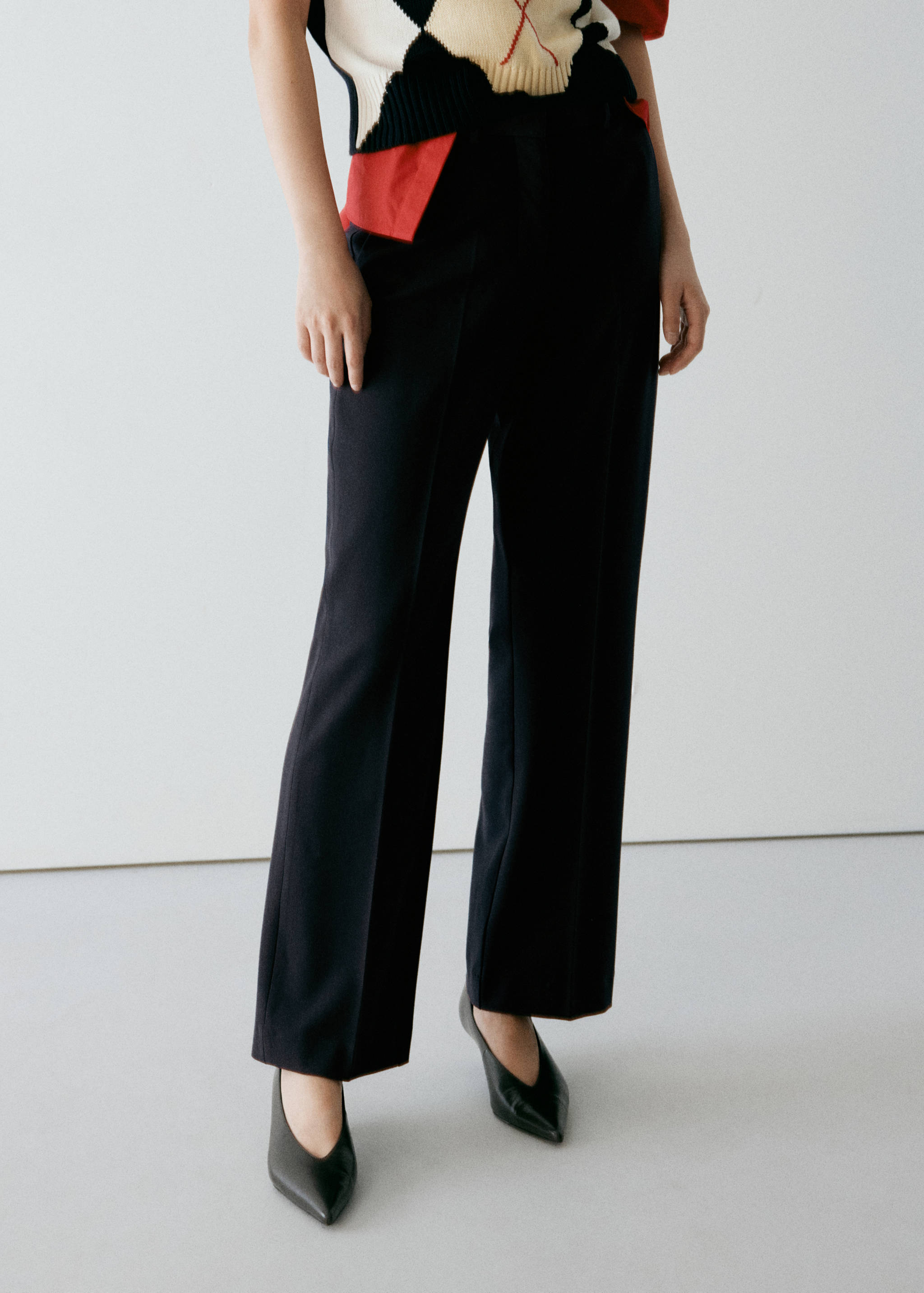 Navy blue wide-leg trousers with pressed creases.