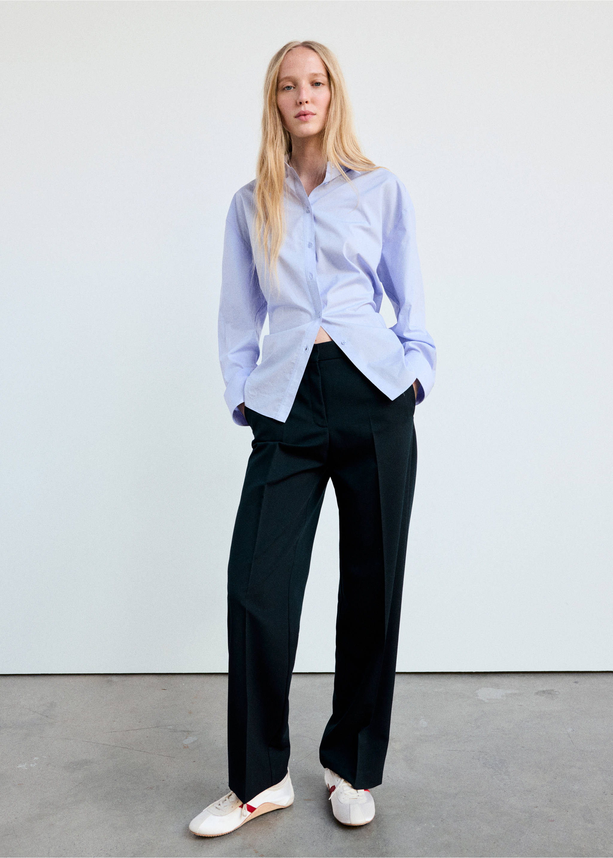 Black trousers with pressed creases, worn with a light blue shirt and white trainers., Dark Navy. Ref: 37095858-01.