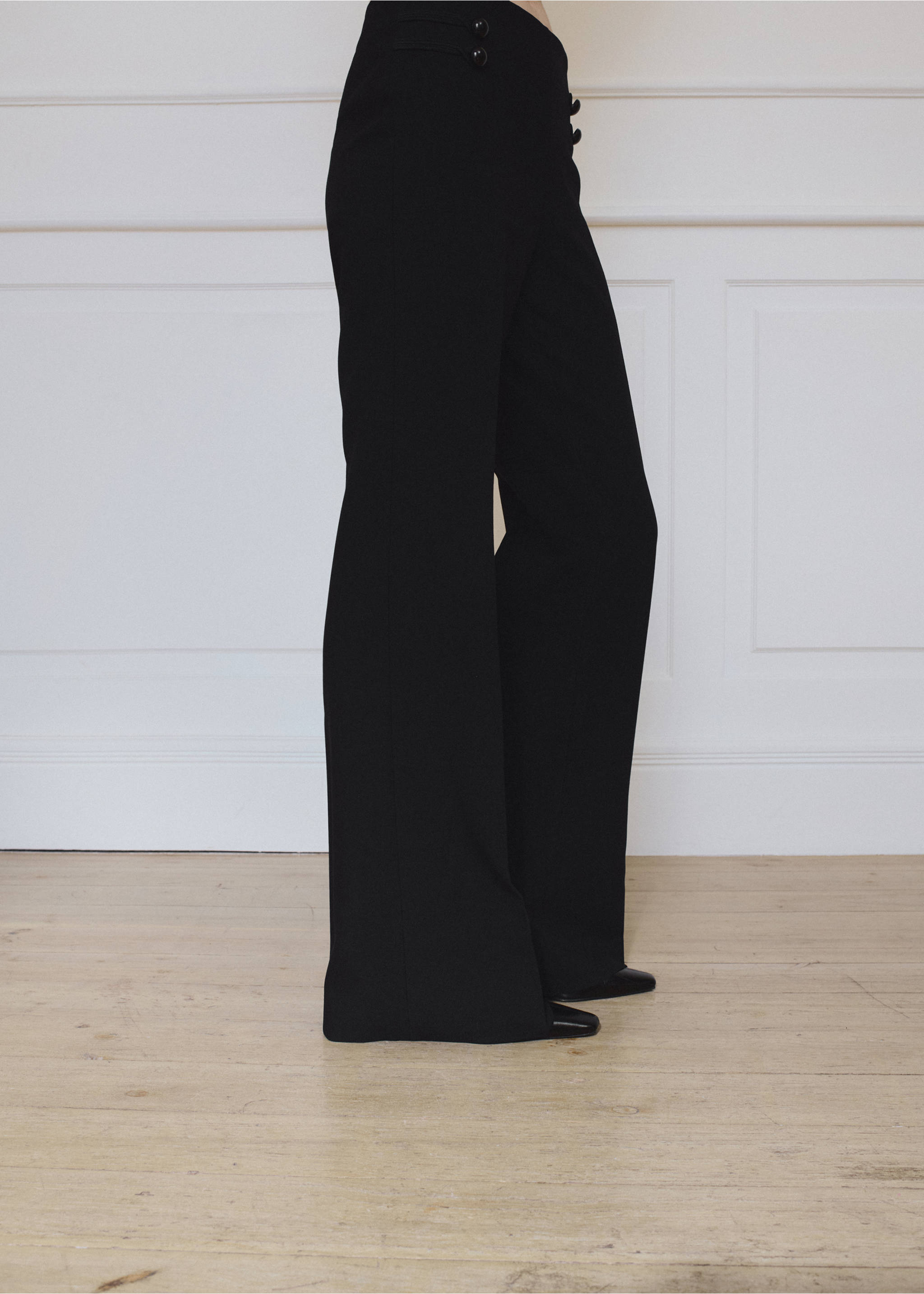 Black flared trousers with button tab details., Black. Ref: 37095869-01.