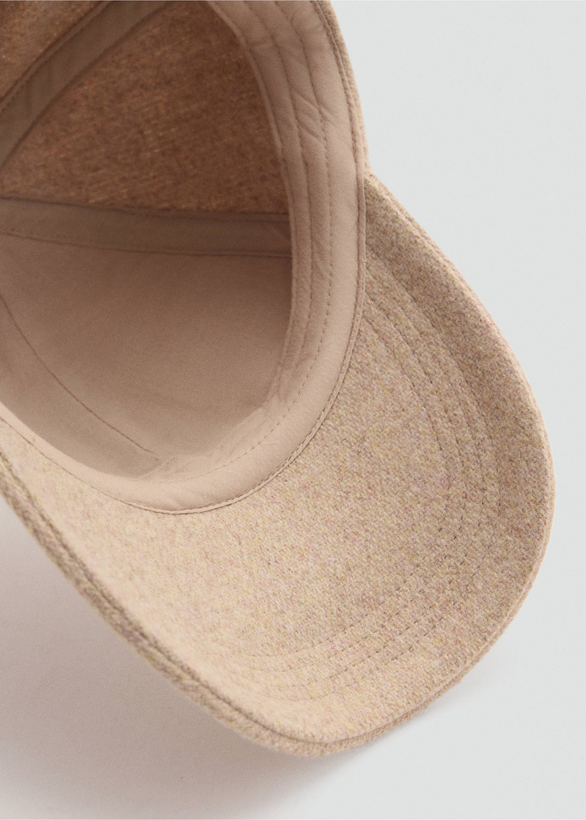 Close-up of a textured beige cap detail showing the interior lining and brim., Sand. Ref: 37095977-00.