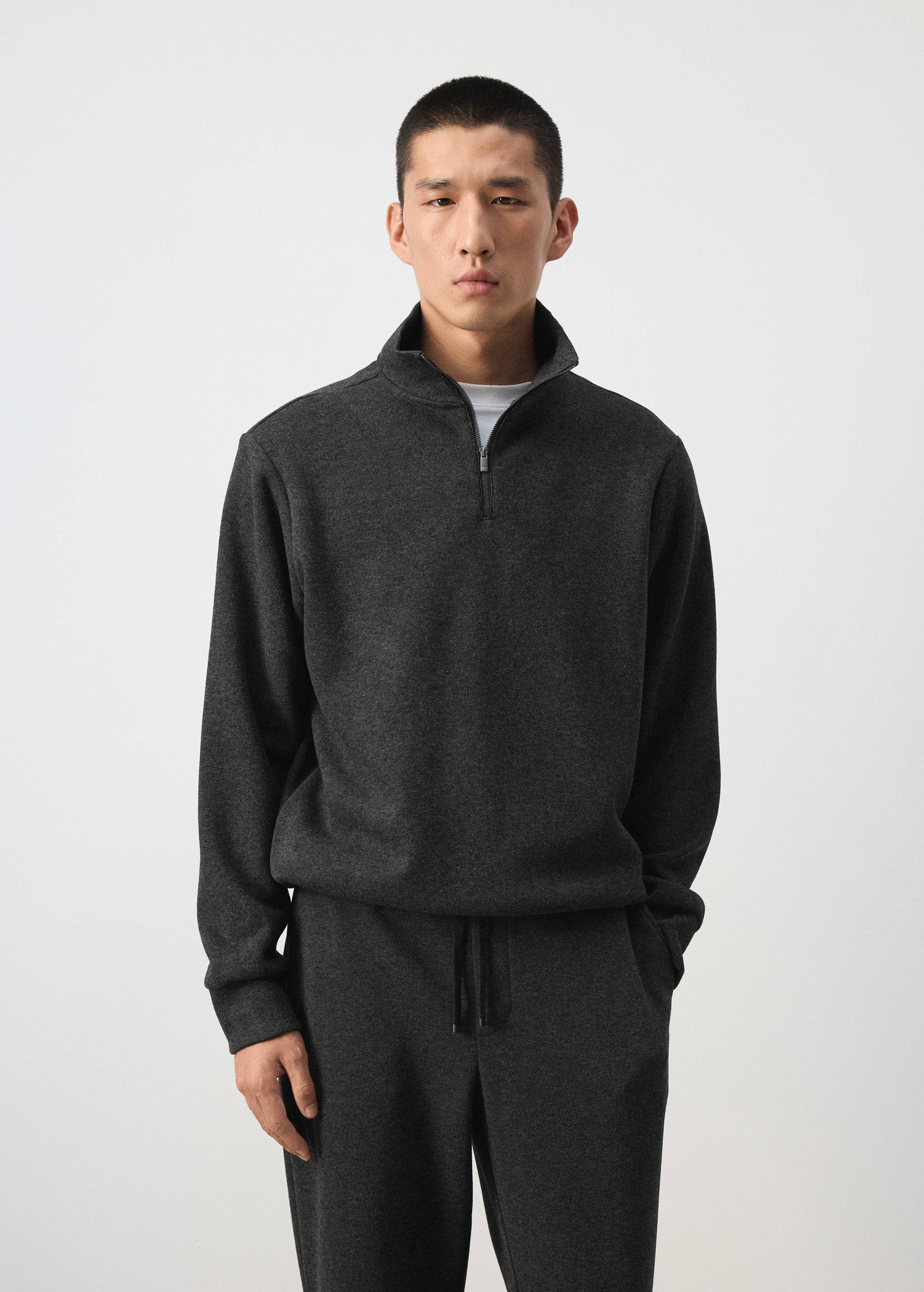Dark grey zip-neck sweatshirt in a relaxed fit with a high collar.