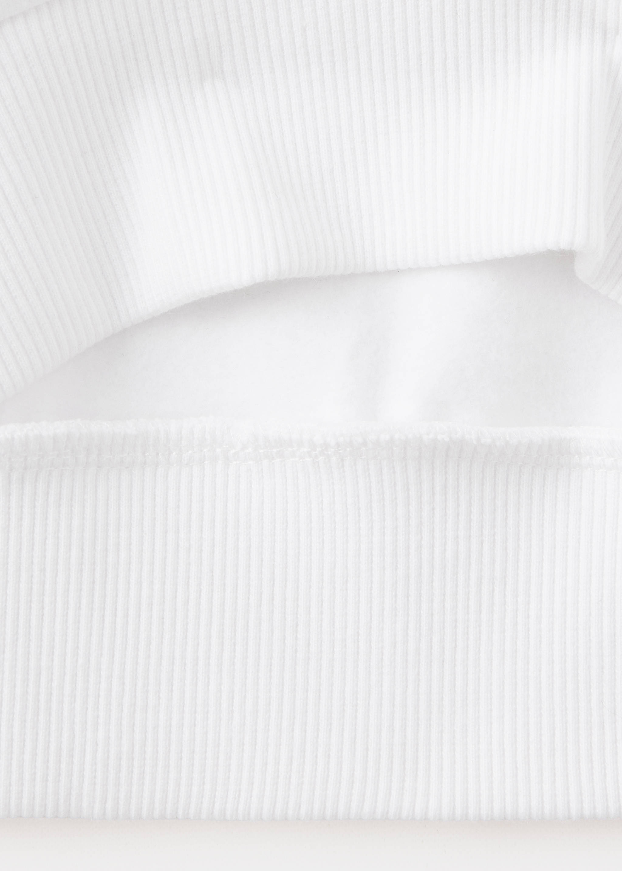 White kids sweatshirt fabric and hem detail