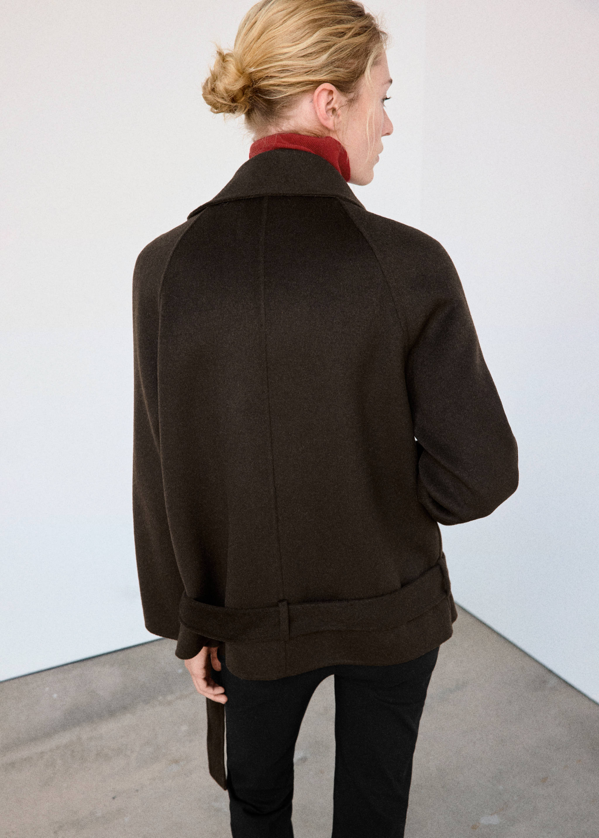 Dark brown jacket with lapel collar and belt, back view