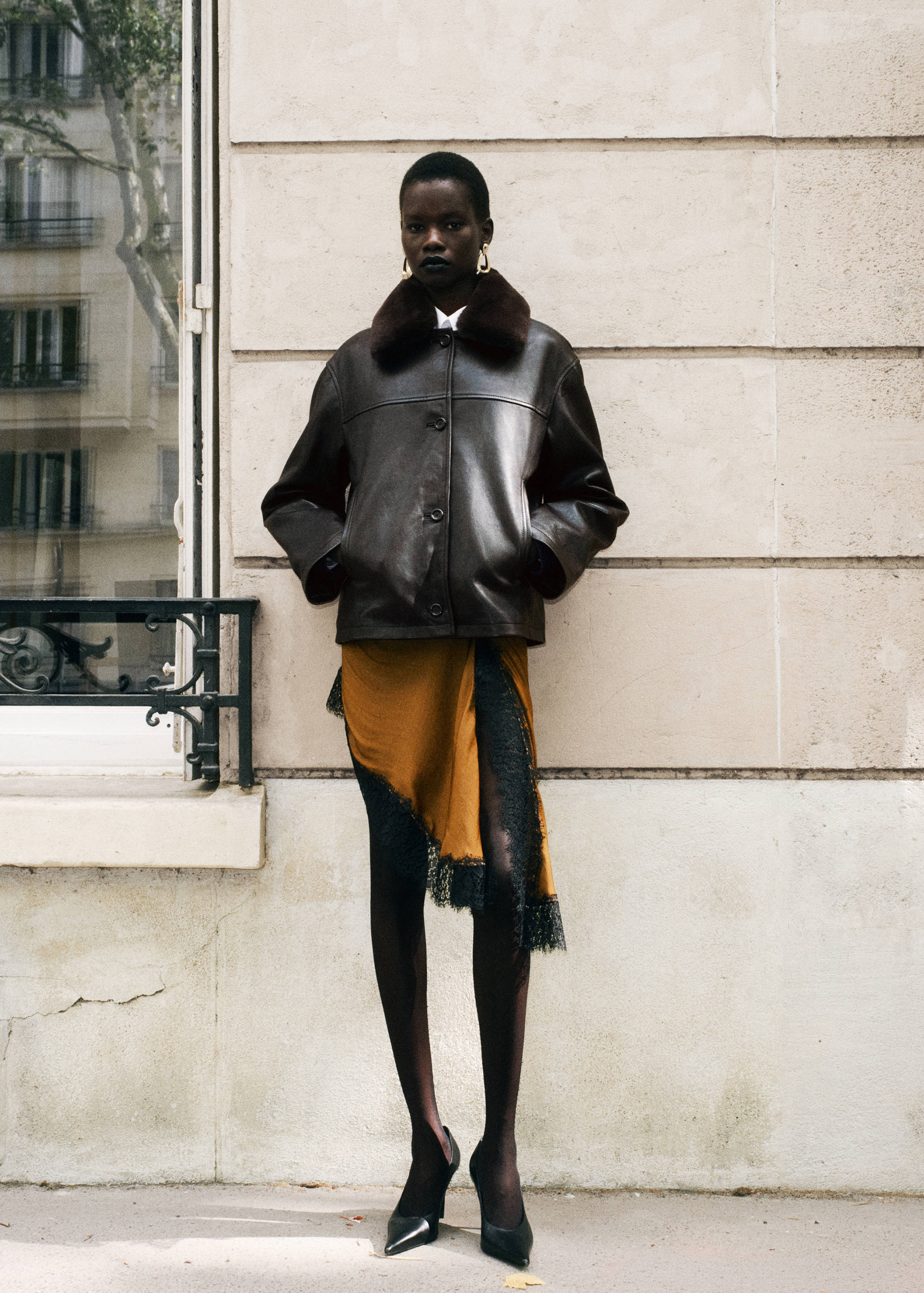 Brown faux-leather jacket with dark brown faux-fur collar.