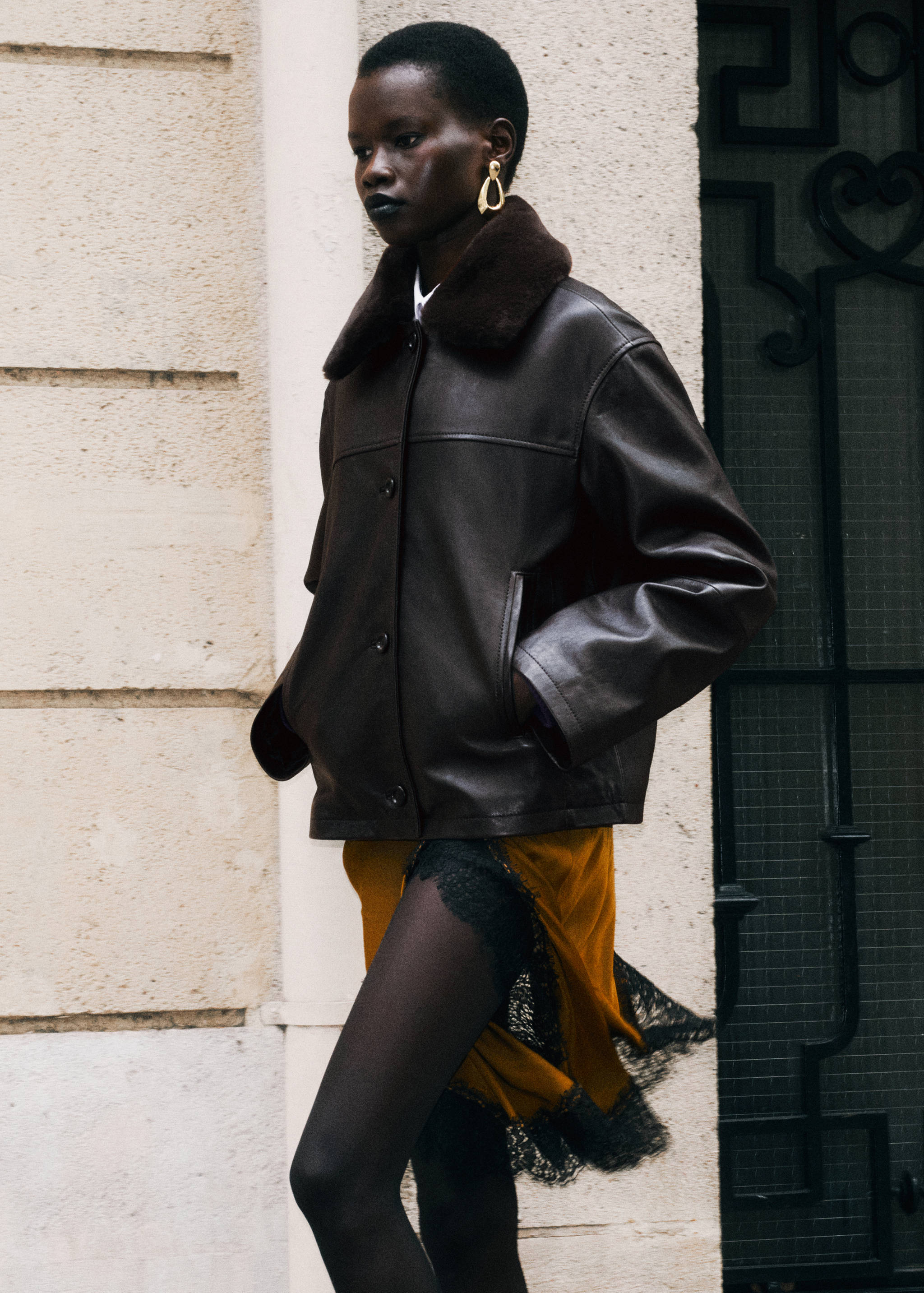 Dark brown leather jacket with faux-fur collar and front buttons
