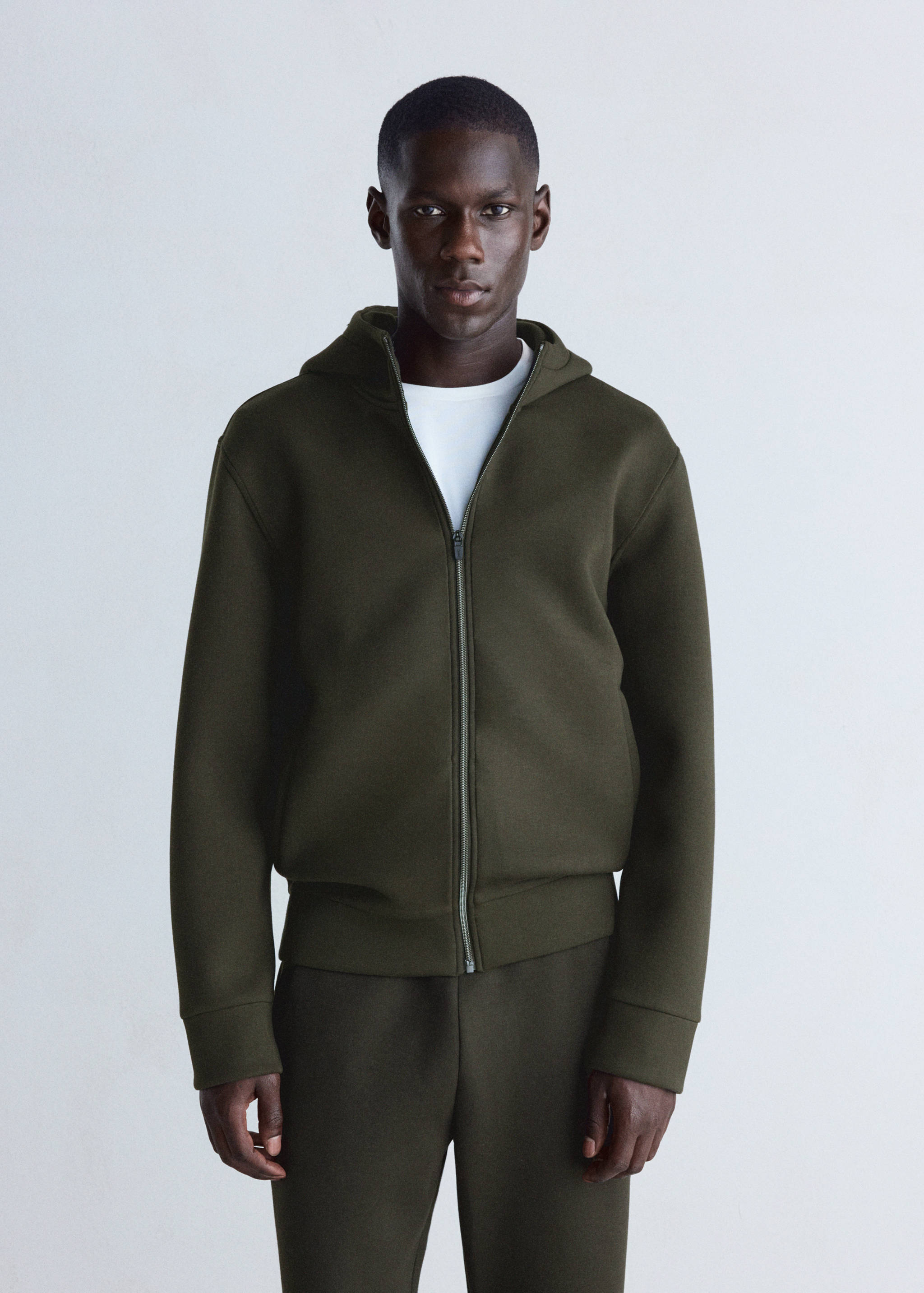 Olive green zip-up hoodie in a regular fit with a hood and ribbed trims.