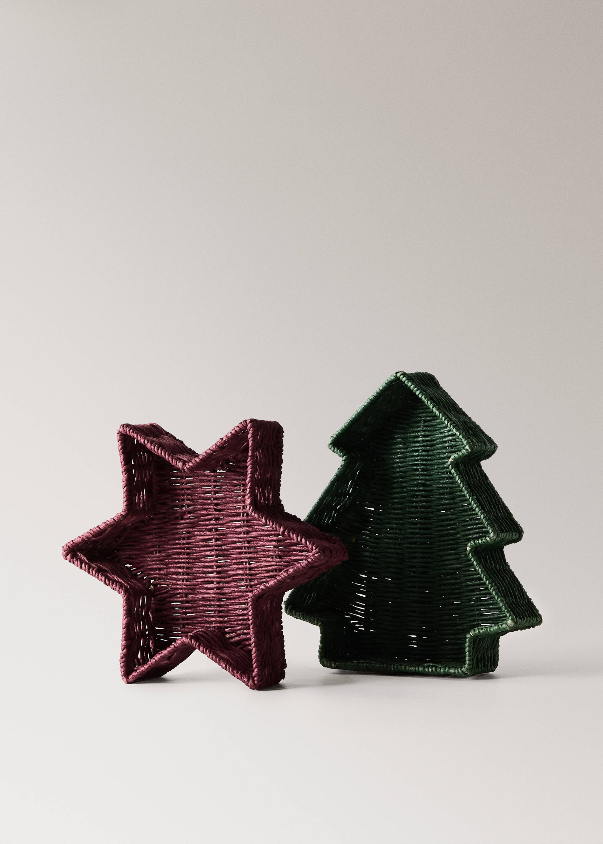 Woven star-shaped burgundy basket and Christmas tree-shaped green basket.