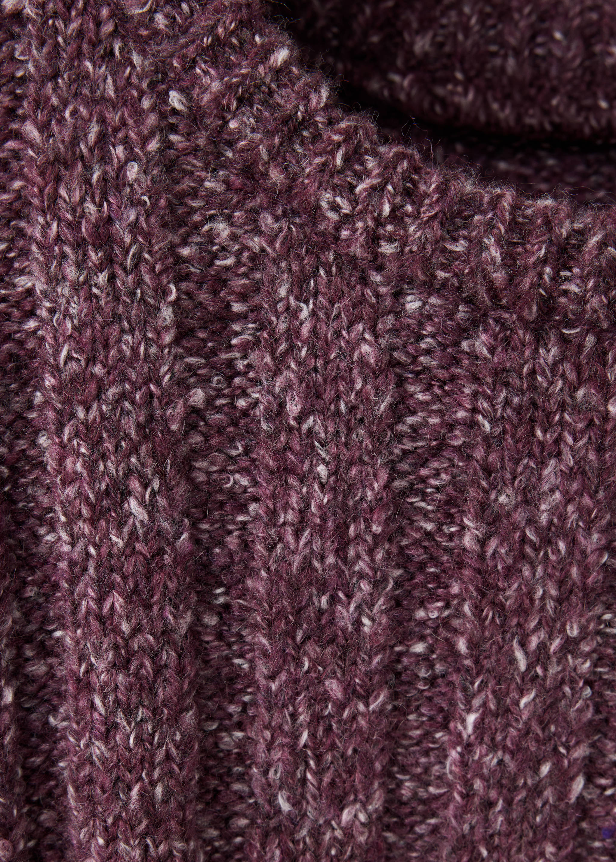 Close-up of a plum ribbed knit kids jersey with a folded collar.