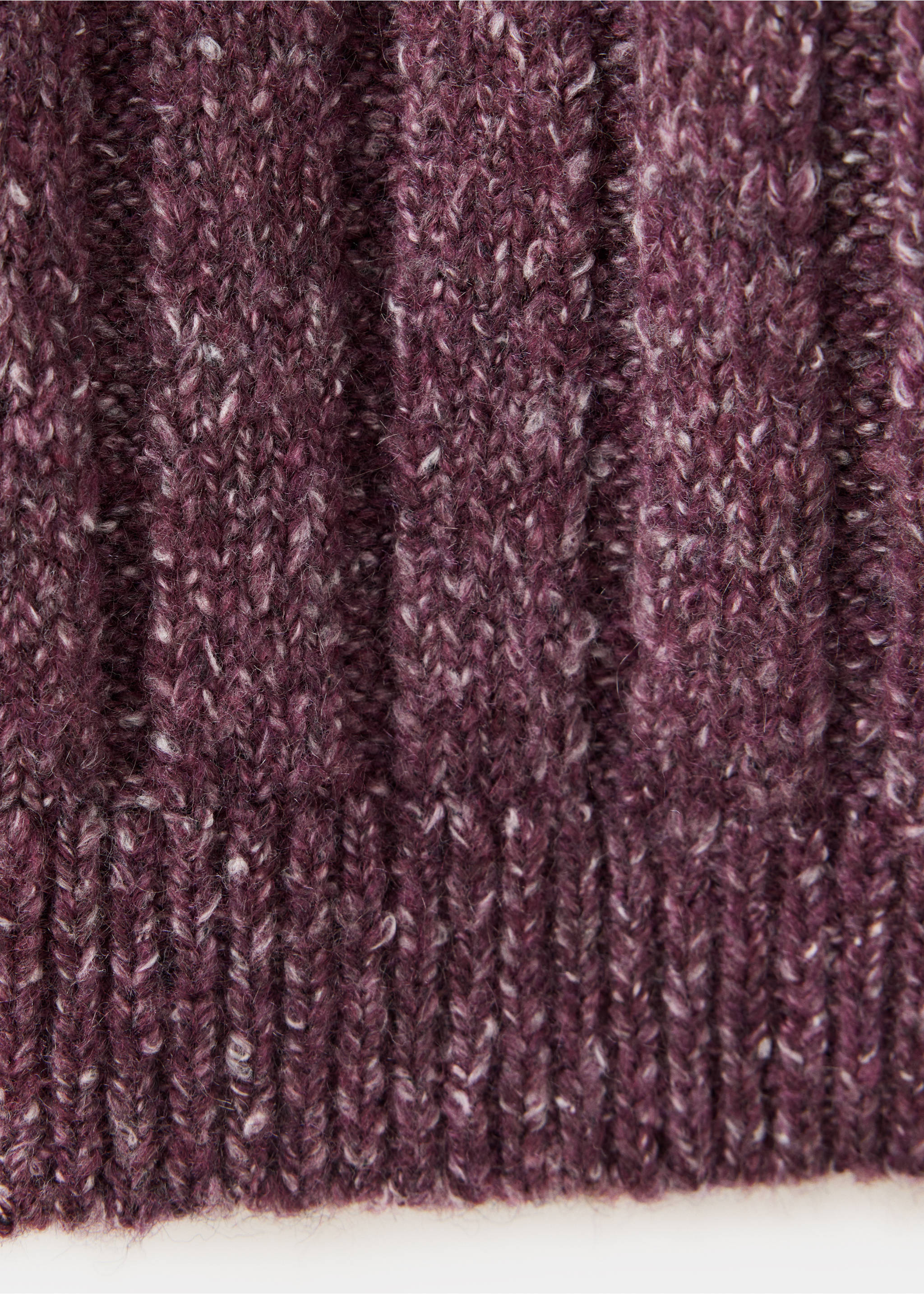 Close-up of the textured plum knit jersey fabric and ribbed hem., Maroon. Ref: 37097123-00.