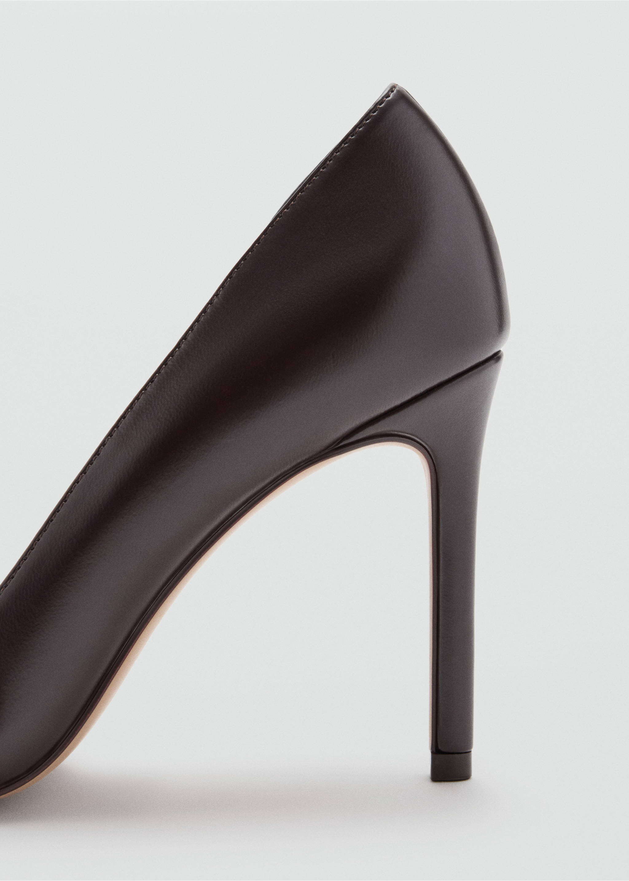 Close-up of a dark brown stiletto shoe heel., Brown. Ref: 37097774-00.