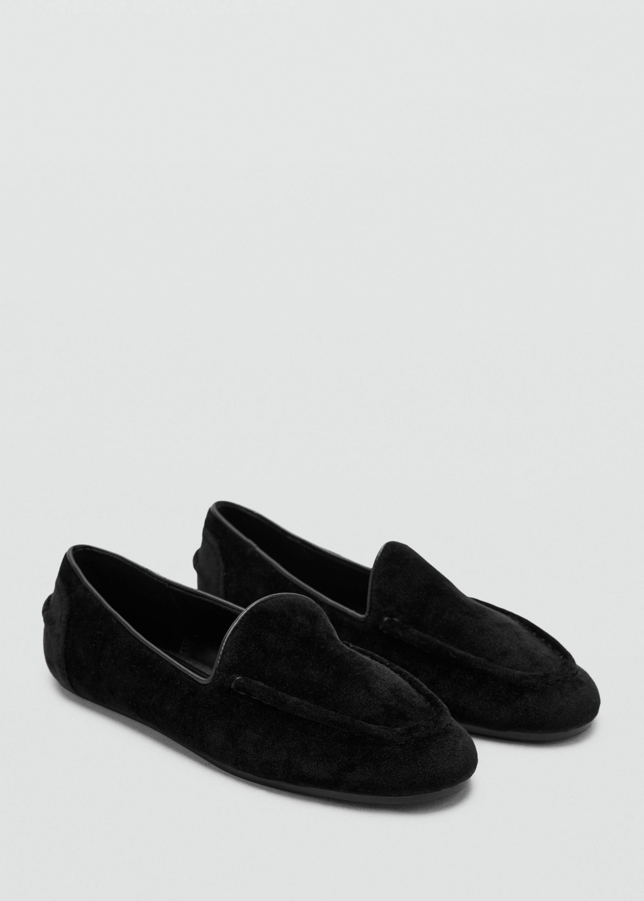Black velvet slip-on loafers with thin collar trim.