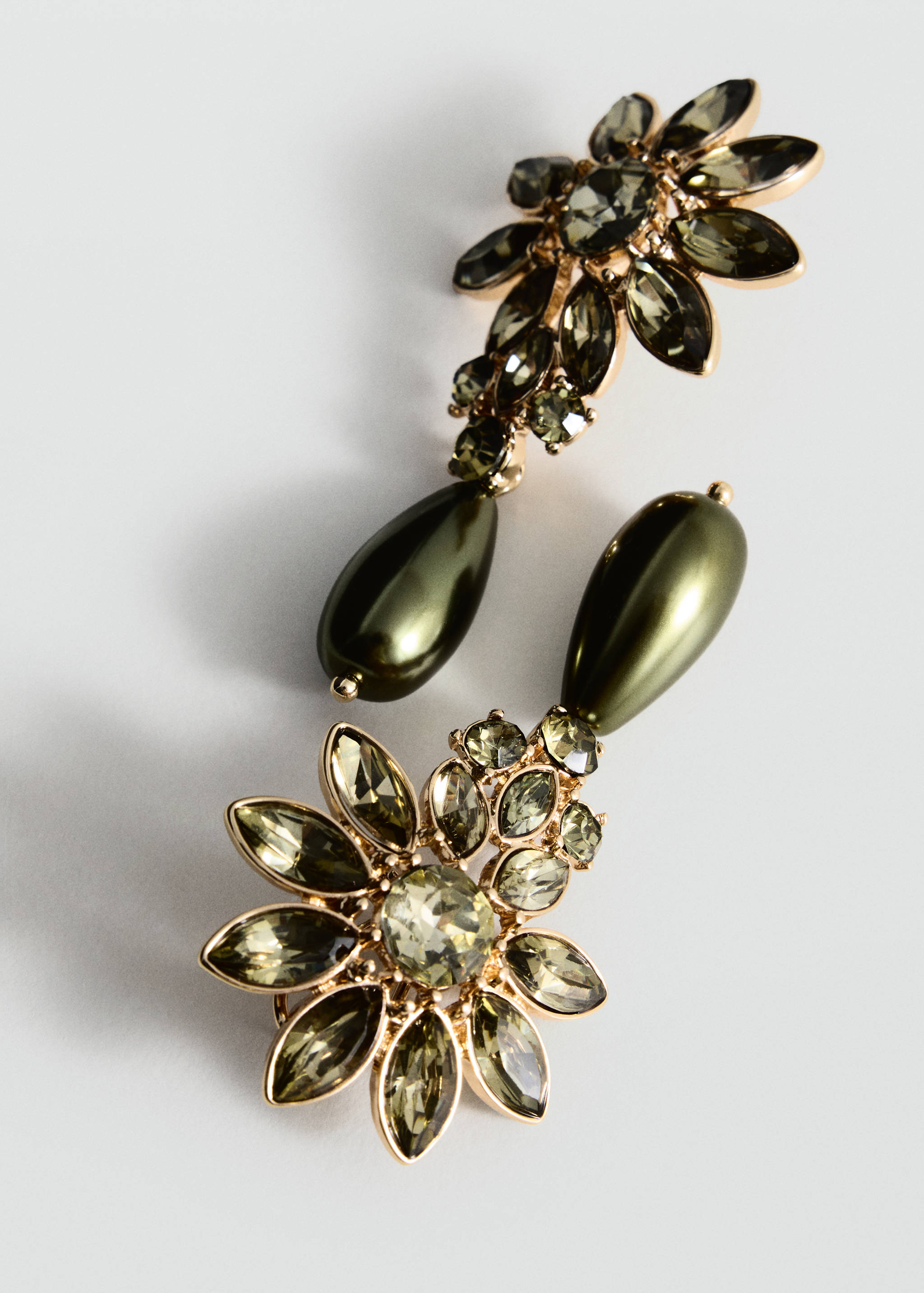 Olive-green crystal and teardrop pearl drop earrings in a gold-tone setting.