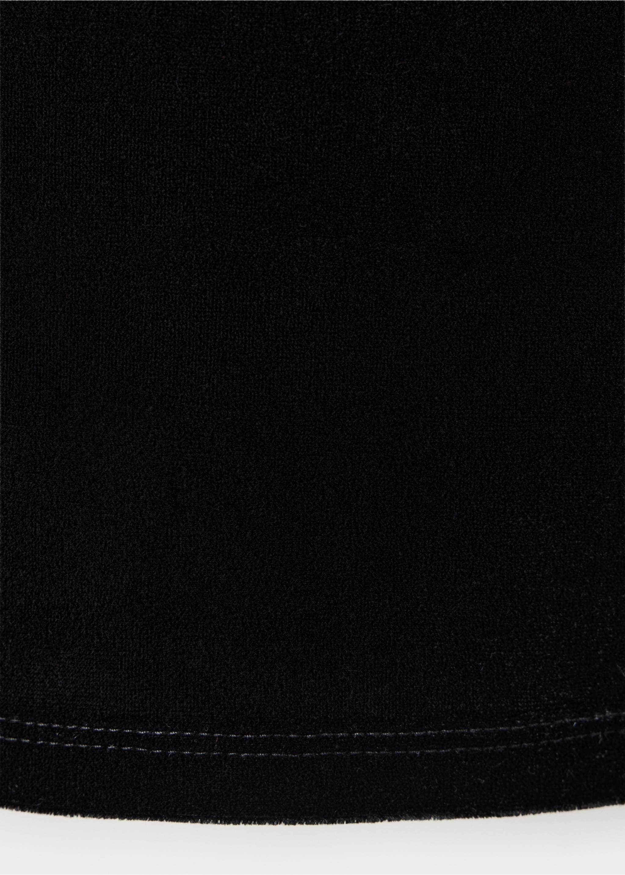 Close-up of black top fabric texture with hem detail., Black. Ref: 37097794-00.