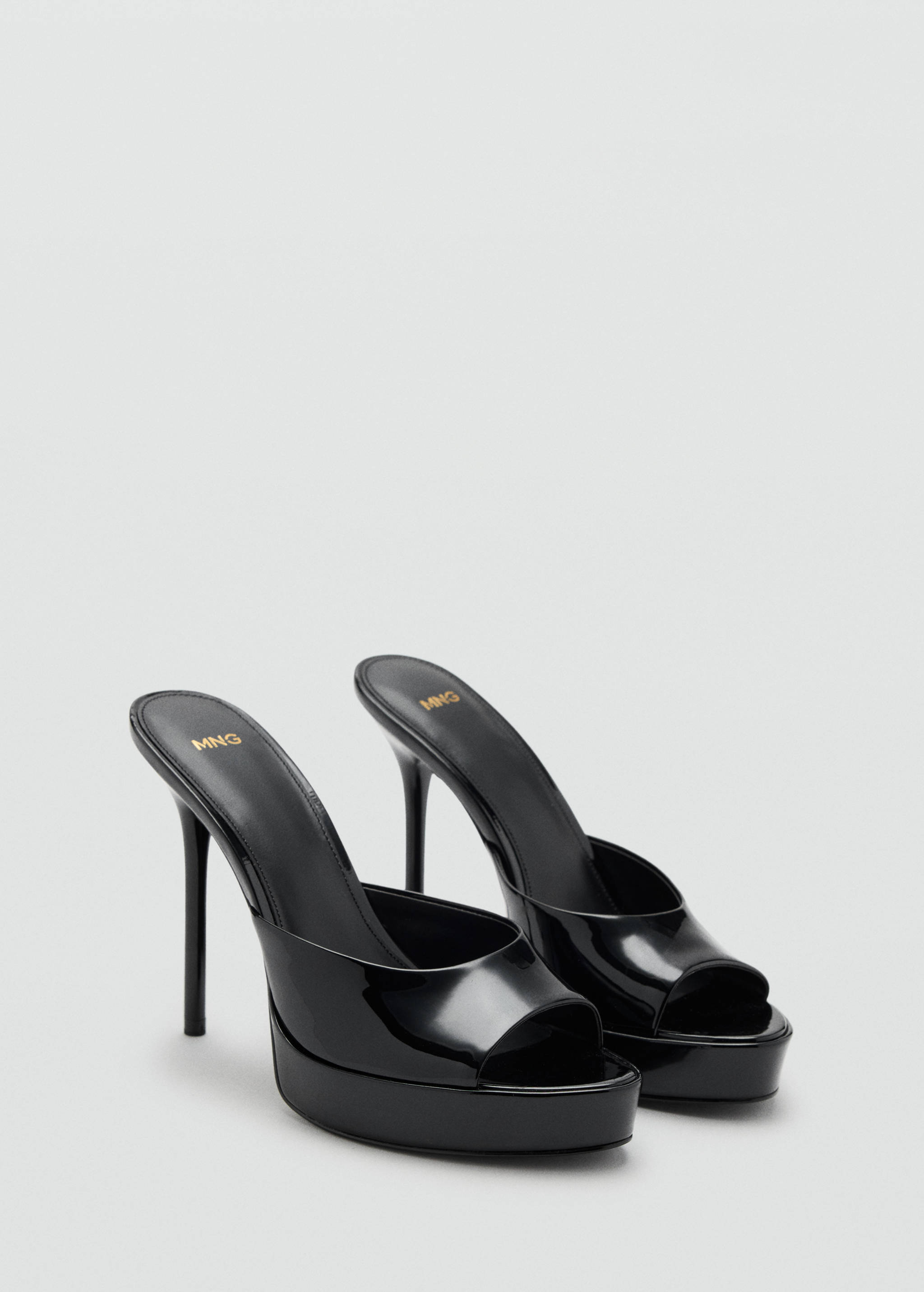 Black patent heeled sandals with a platform sole and stiletto heel.