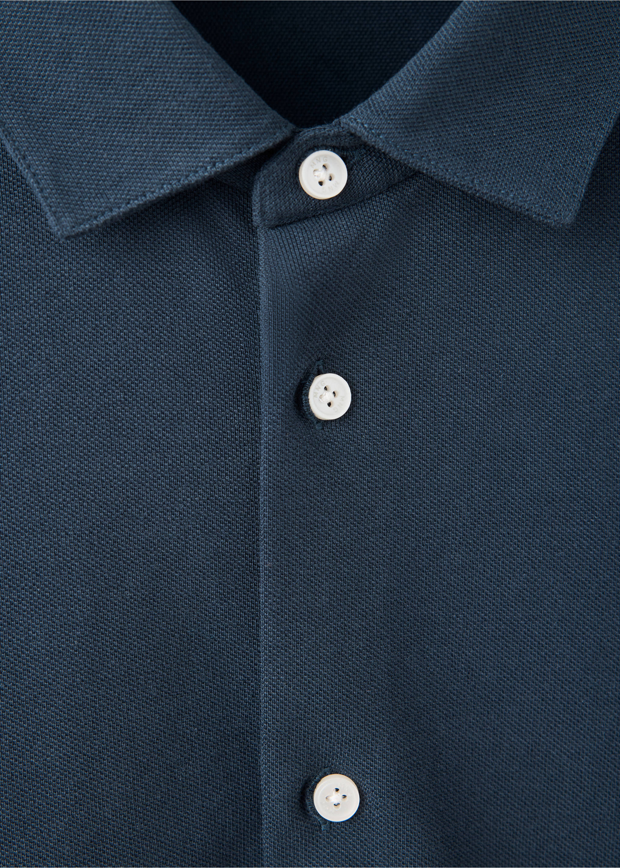 Close-up of a dark blue polo shirt collar and button placket., Navy. Ref: 37097805-00.