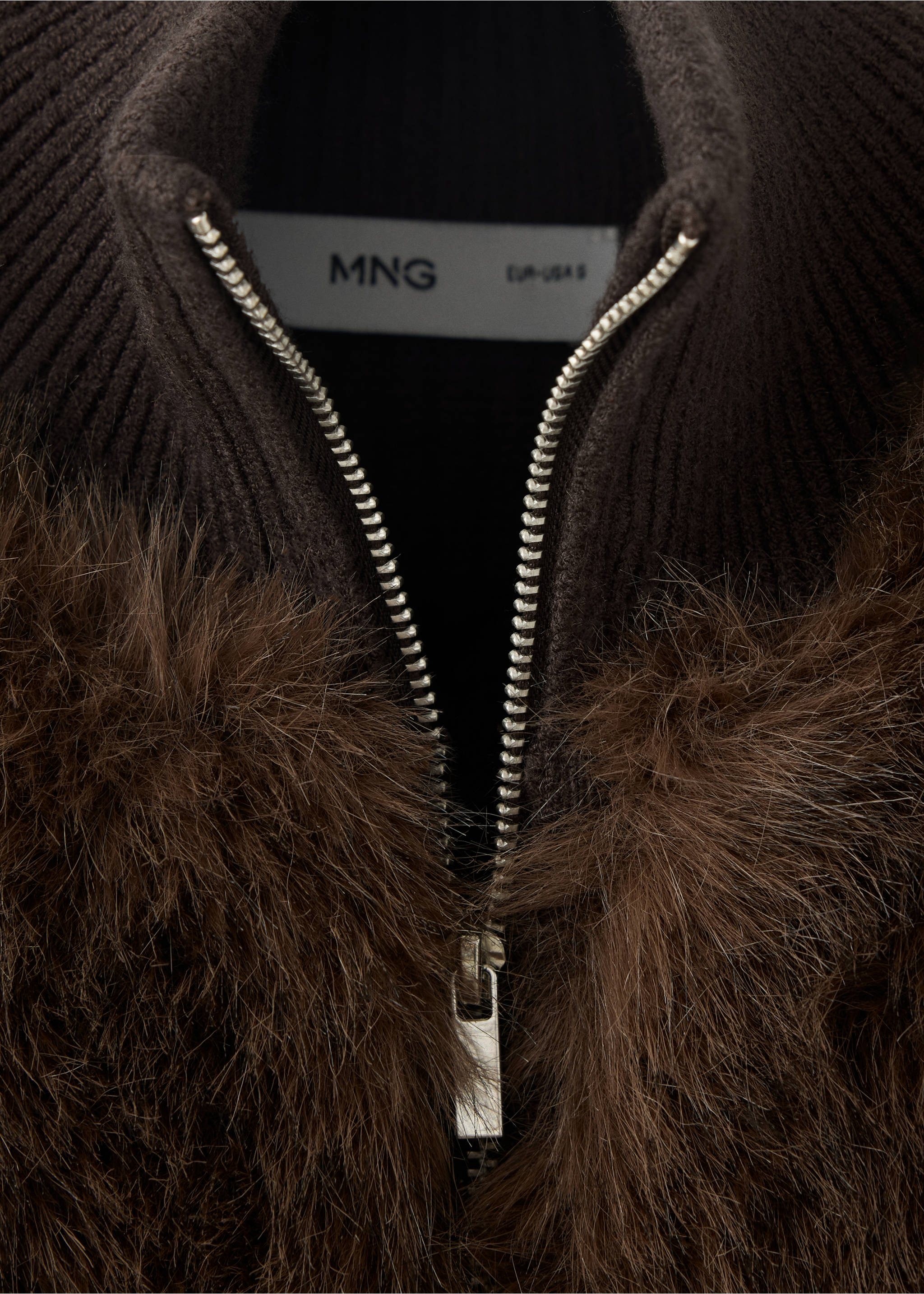 Close-up of a dark brown knitted jacket with a silver zip and faux-fur trim., Chocolate. Ref: 37097806-00.