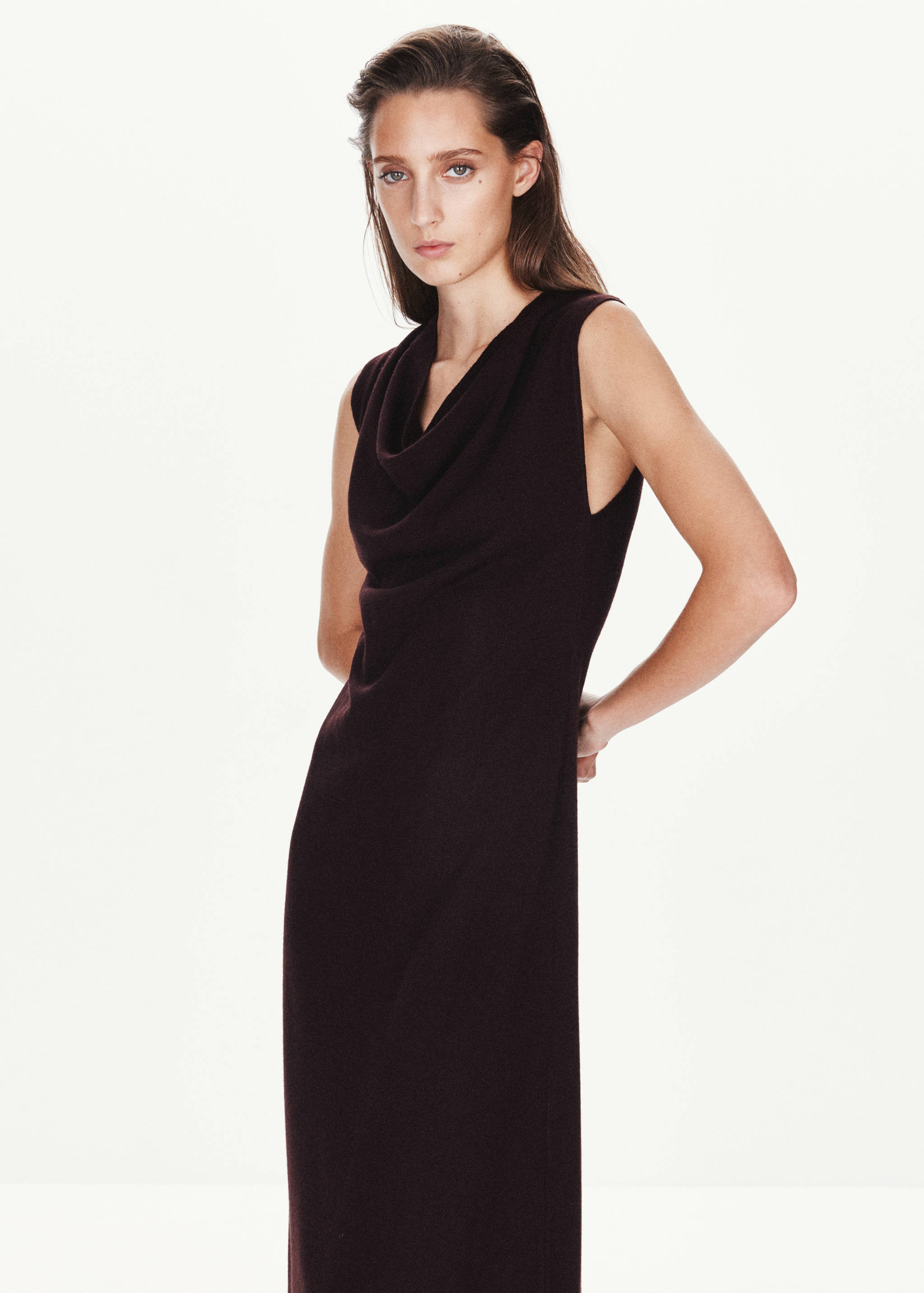 Dark brown sleeveless midi dress with a cowl neckline.