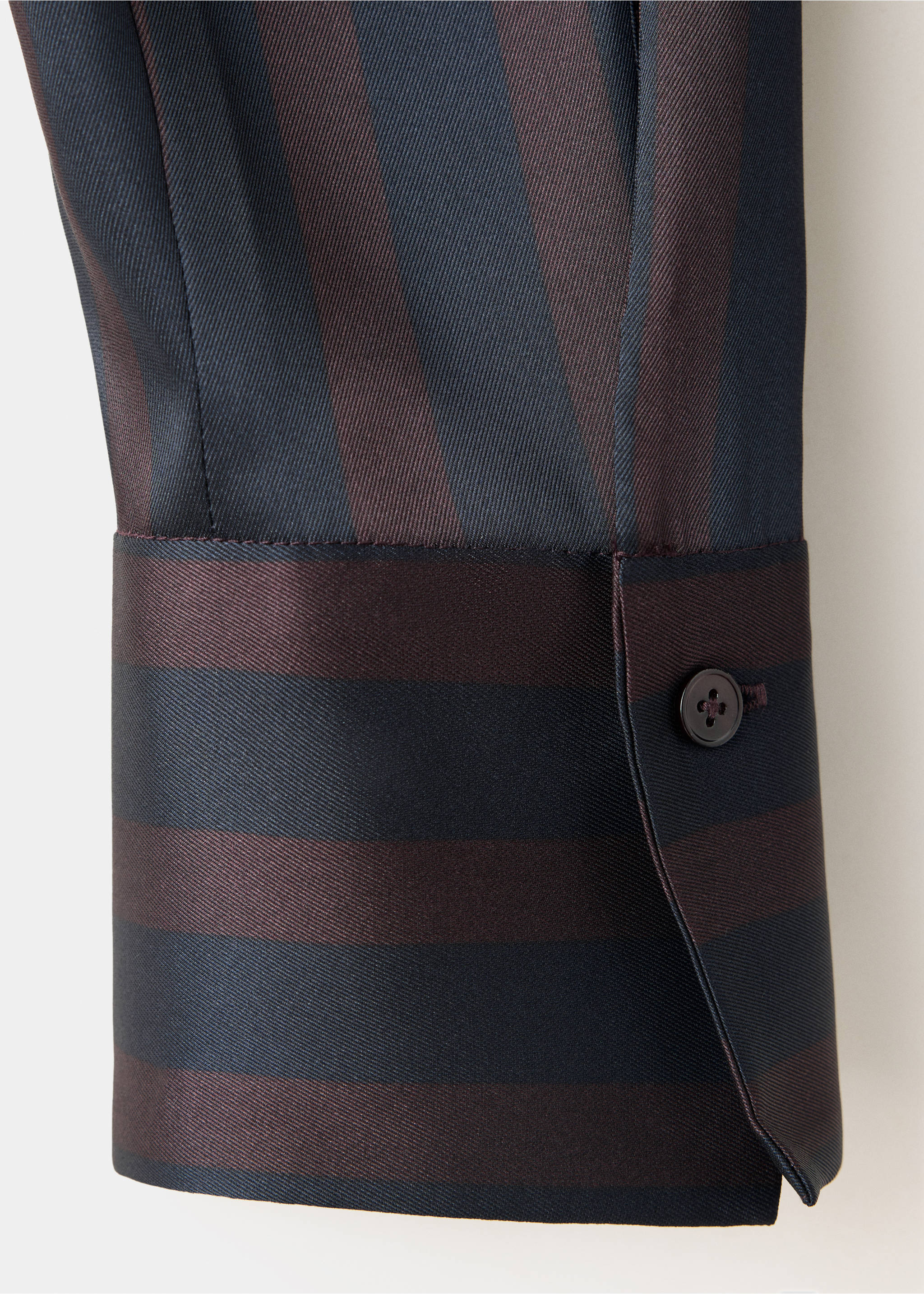 Close-up of a striped blouse cuff with dark blue and brown patterns., Dark Navy. Ref: 37097812-00.