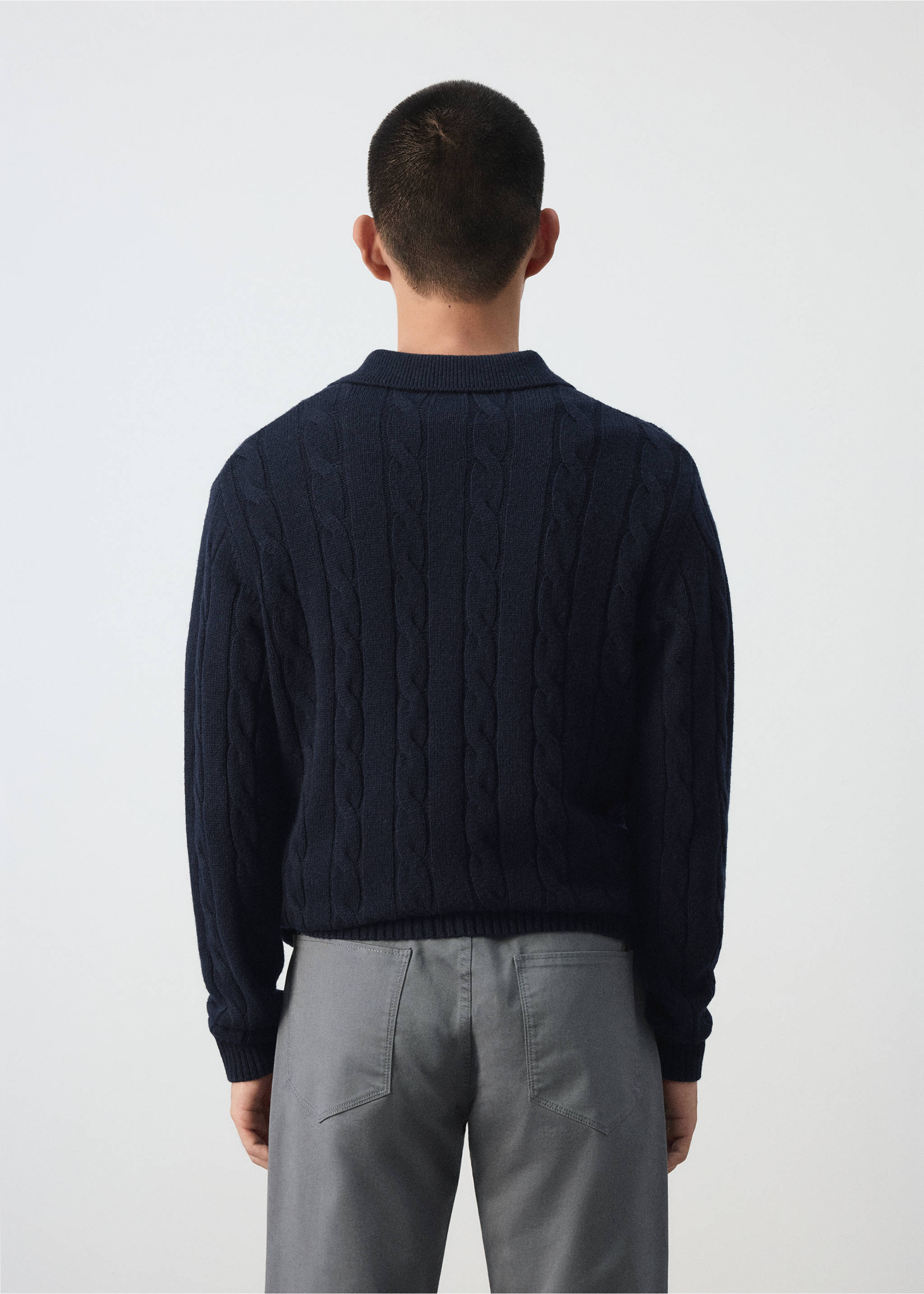 Back view of a navy blue cable-knit polo sweater with a collar., Navy. Ref: 37097885-00.