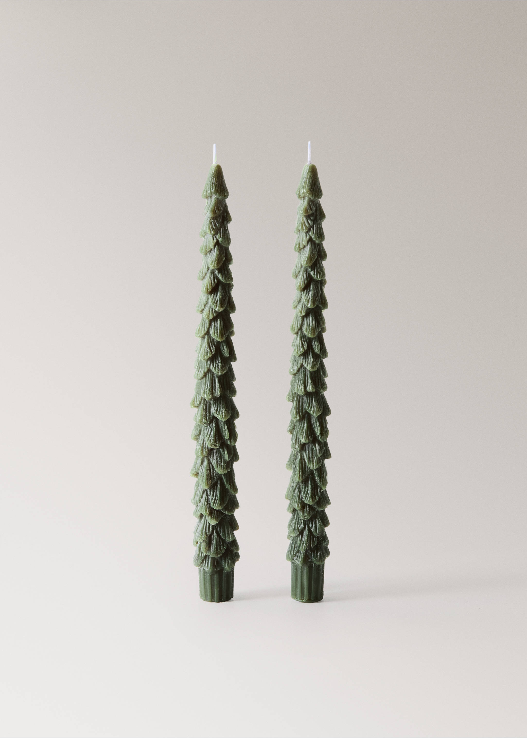 Two tall green tree-shaped candles with textured pine needle details., Green. Ref: 37097889-00.