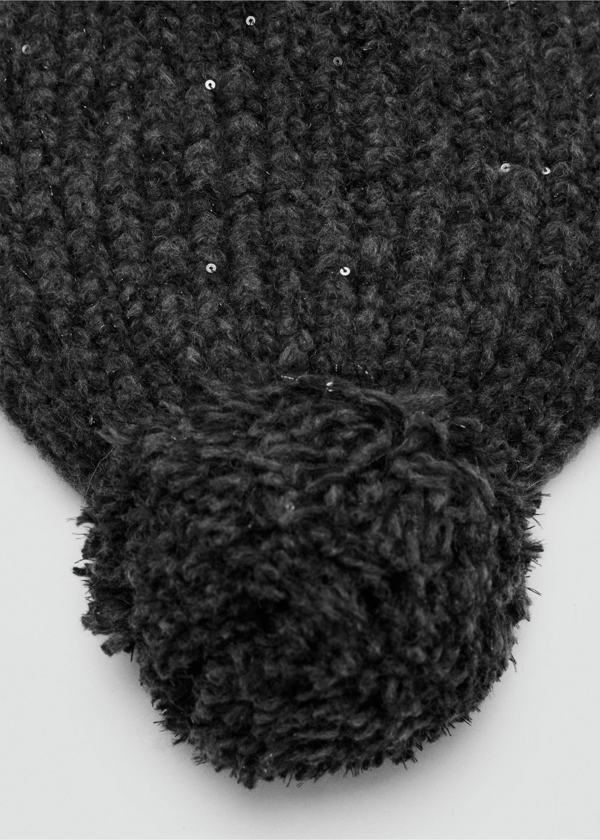 Close-up of a black knitted beanie with sequins and a pom-pom., Charcoal. Ref: 37097894-00.