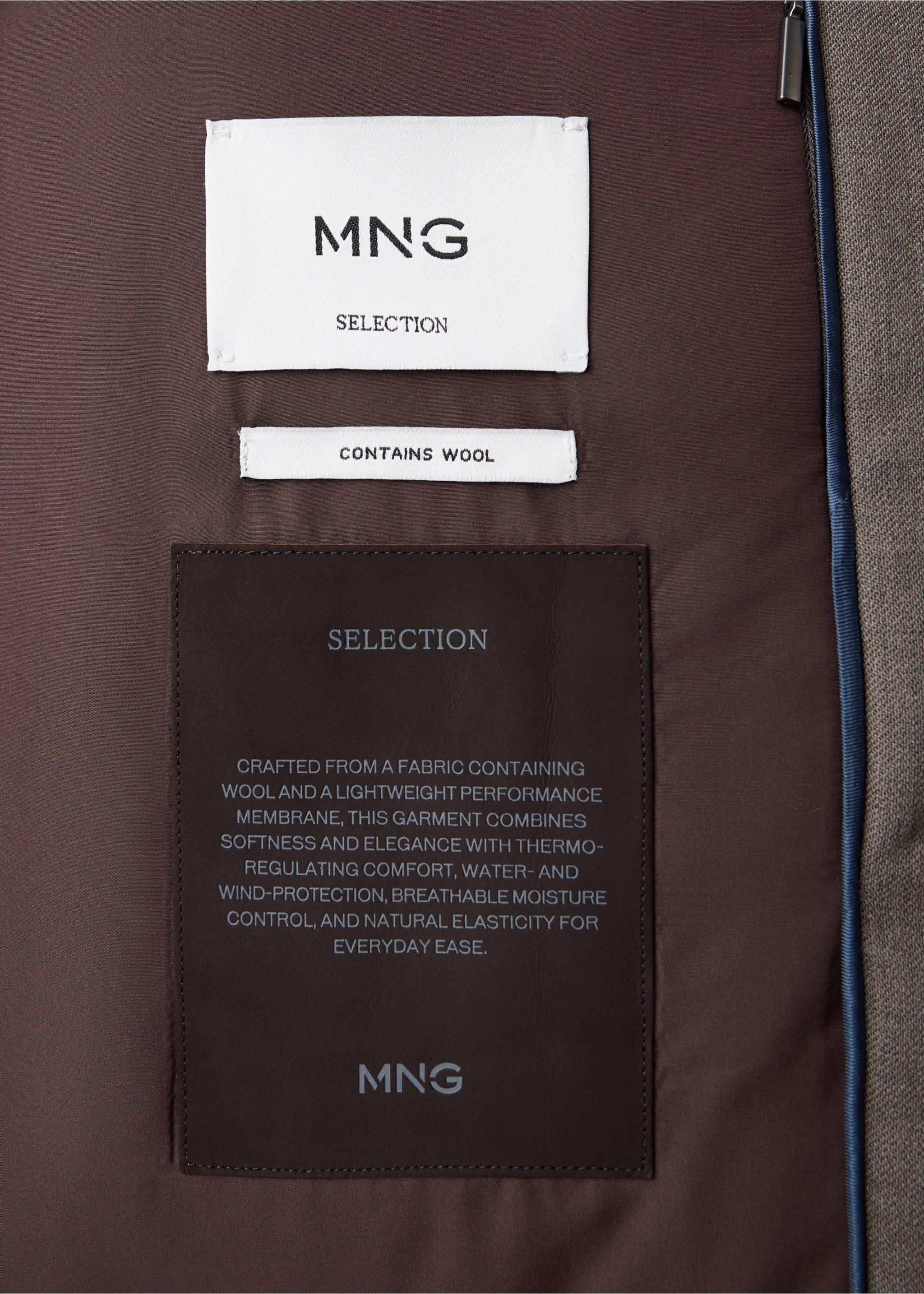 Close-up of the interior lining and wool-blend labels of a brown trench coat., Medium Brown. Ref: 37097897-00.