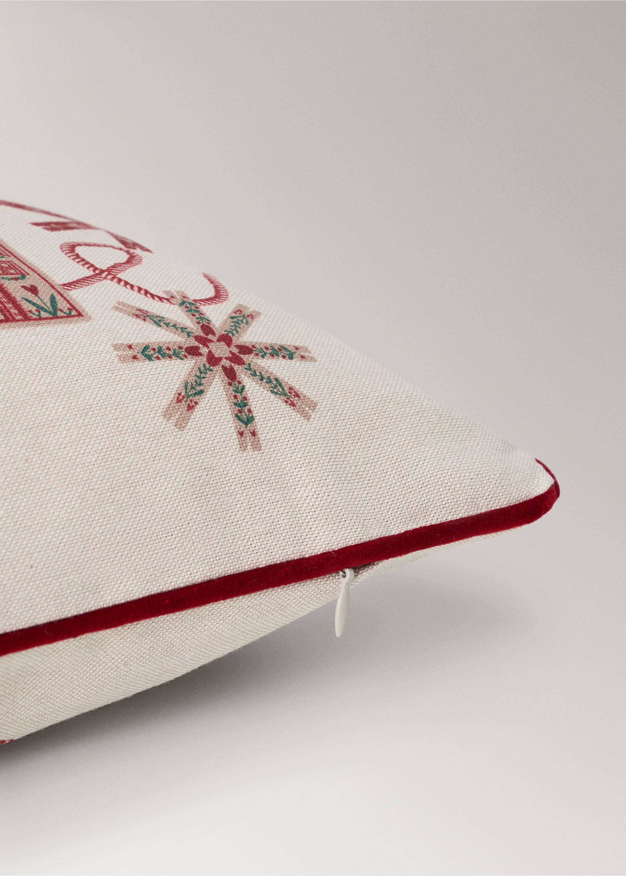 Cushion cover detail with festive print and red piping., Red. Ref: 37097934-00.
